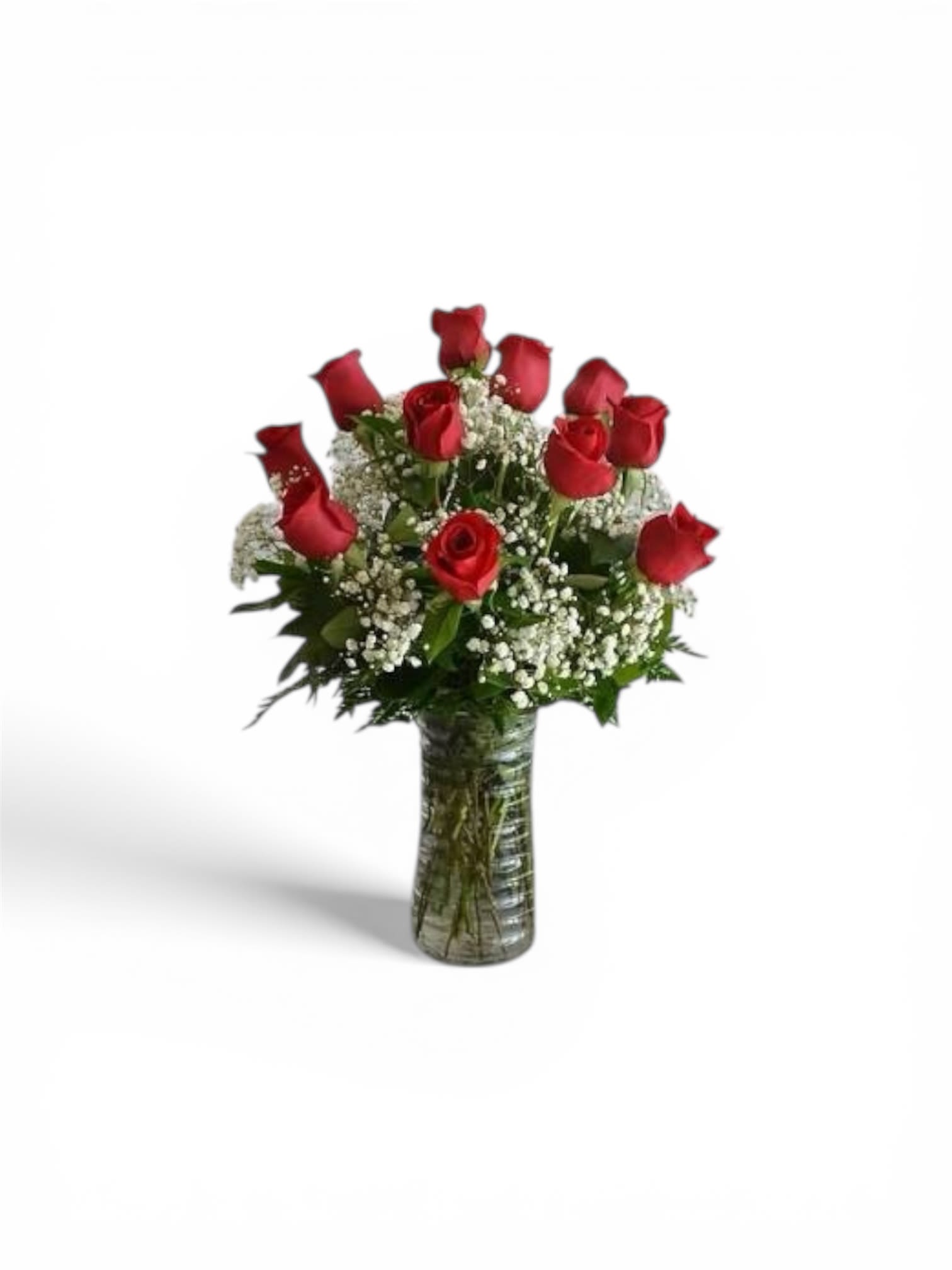 One Dozen Red Velvet Roses with Babies Breath - Velvety red roses arranged upright in a classic dozen create an immediate romantic impact - the ideal birthday bouquet, anniversary roses, or a timeless Valentine's Day surprise that also reads right for Mother's Day, Graduation, or to say "I'm Sorry." The mood is elegant and intimate, so the person you're thinking of will feel adored and truly seen whether this is a love-and-romance gift, a sympathy tribute for Memorial Day, or a simple "Thinking of You" moment.  Each bouquet features twelve deep-red roses spaced evenly with clusters of small white baby's breath tucked between the blooms for soft contrast and delicate texture. The stems are displayed in a tall, clear glass vase that shows the natural lines of the roses and keeps the arrangement upright and traditional - a clean look that fits holiday dinners, housewarmings, prom nights, or a tasteful centerpiece for Easter and Thanksgiving. Available in a standard size; to keep flowers fresh, change the water every two days, trim stems at an angle, and place away from direct heat and drafts.