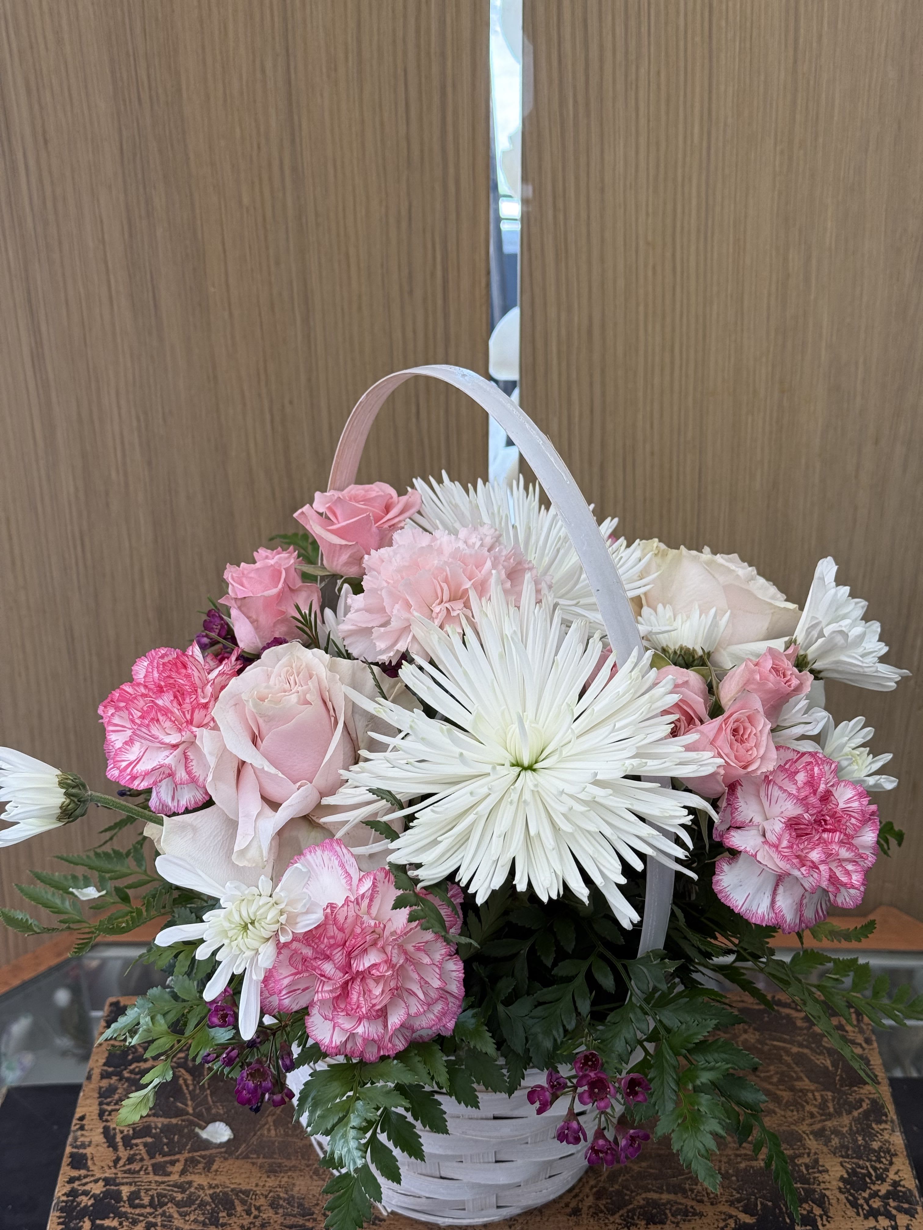 Pink Basket - Pink and white mixed flowers arranged in a white basket. 
