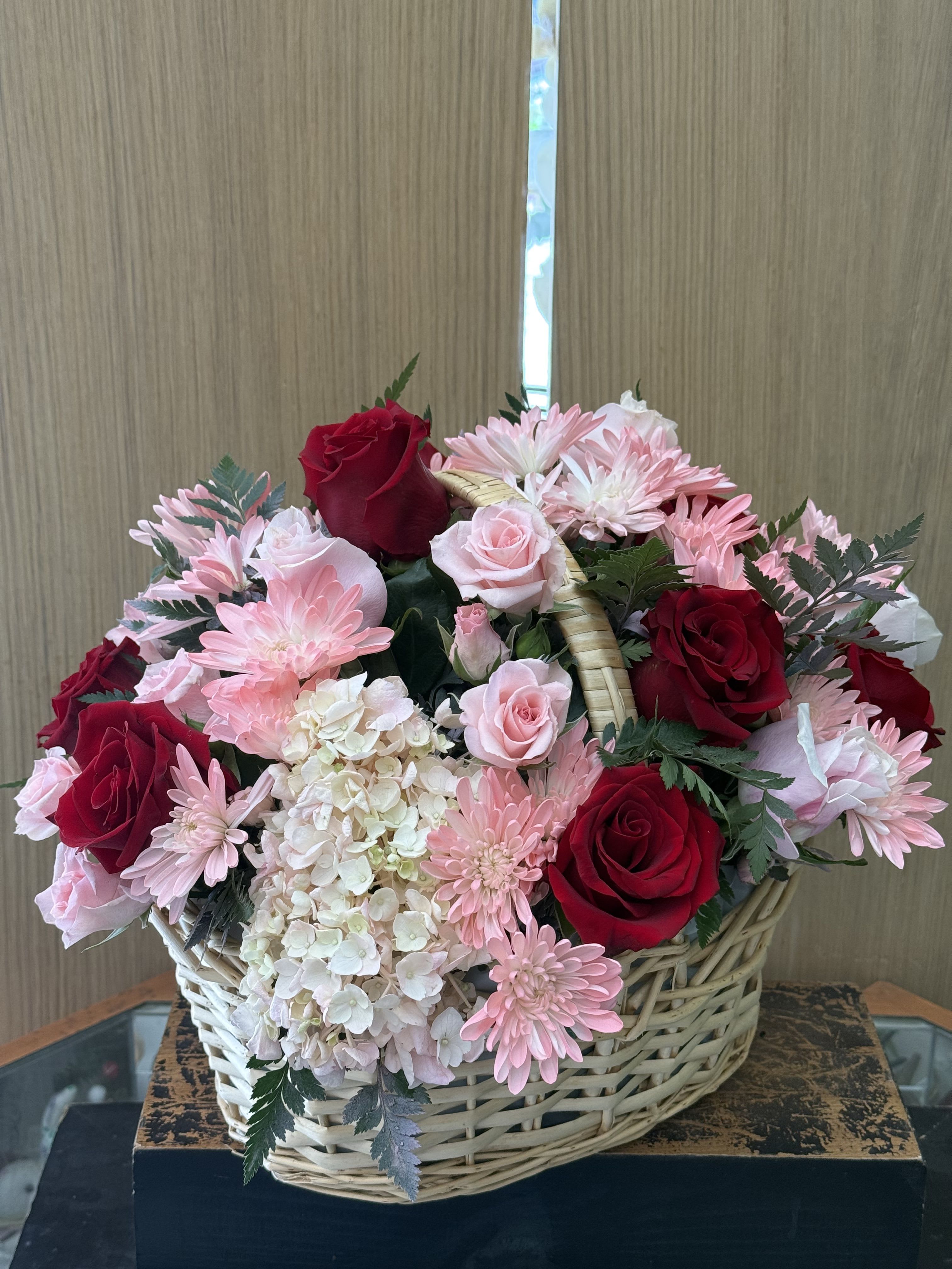 Pinky Perfect Arrangement  - Red Ecuadorian roses with mixed pink flowers arranged in a basket. 