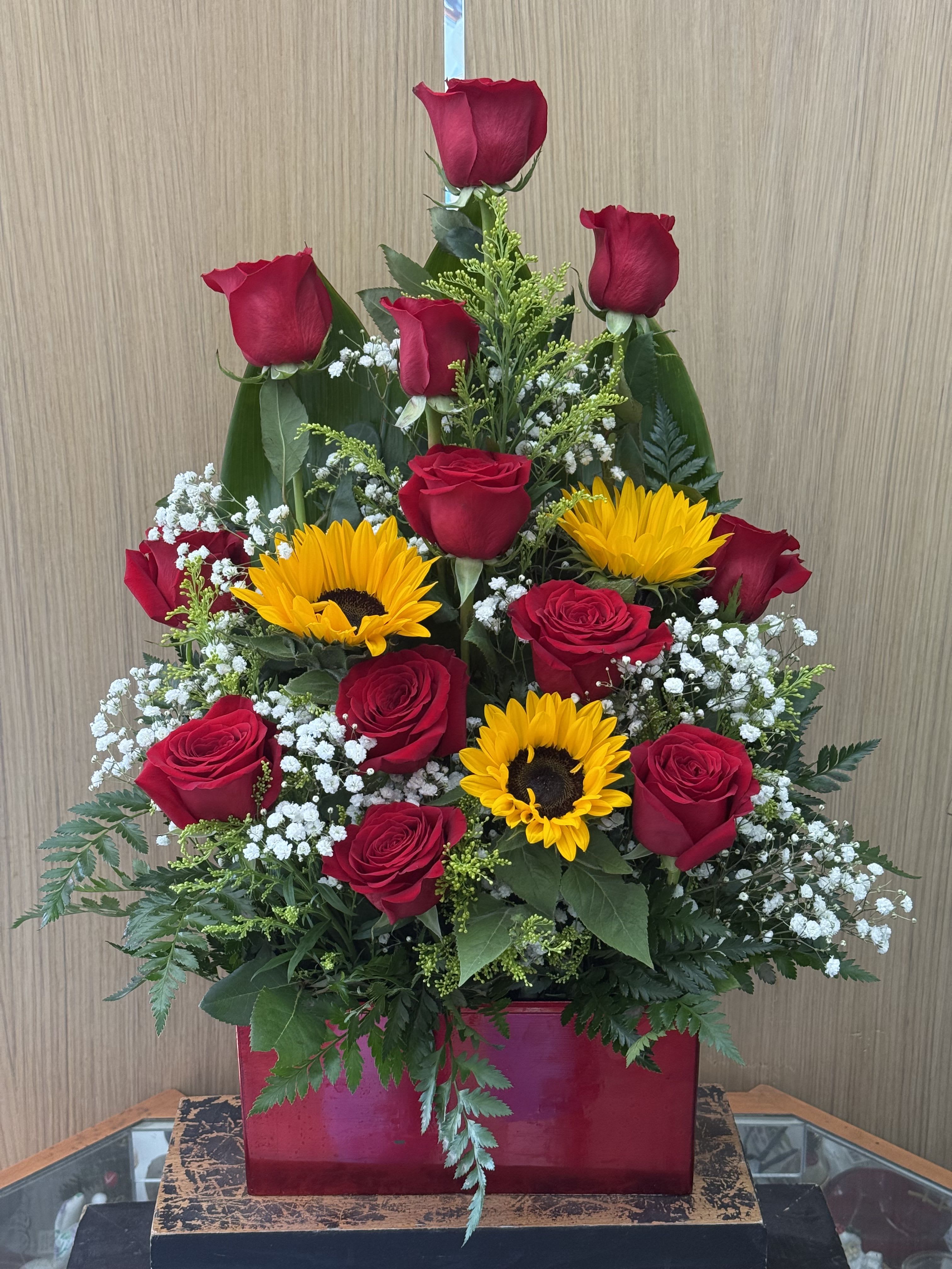 Sunset Arrangement  - One dozen Ecuadorian roses with sunflowers. 