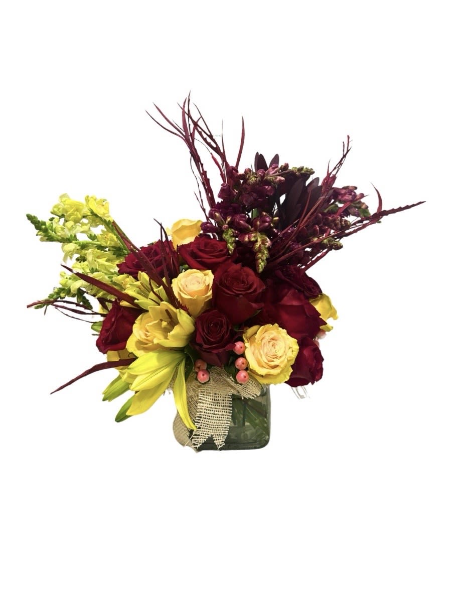 Fresh Red &amp; Yellow Flower Arrangement - A vibrant and elegant red and yellow rose arrangement designed to brighten any occasion. This floral design features fresh red roses combined with yellow blooms and seasonal accents, arranged in a modern glass vase for a clean and refined look.  Perfect for birthdays, celebrations, thank you gifts, or just because. This colorful arrangement brings warmth, energy, and a sophisticated touch to any space.  Available for flower delivery in Naples, FL and surrounding areas. Same-day delivery may be available.  Note: Flower varieties may vary based on availability. The overall color palette and design style will always be carefully maintained.