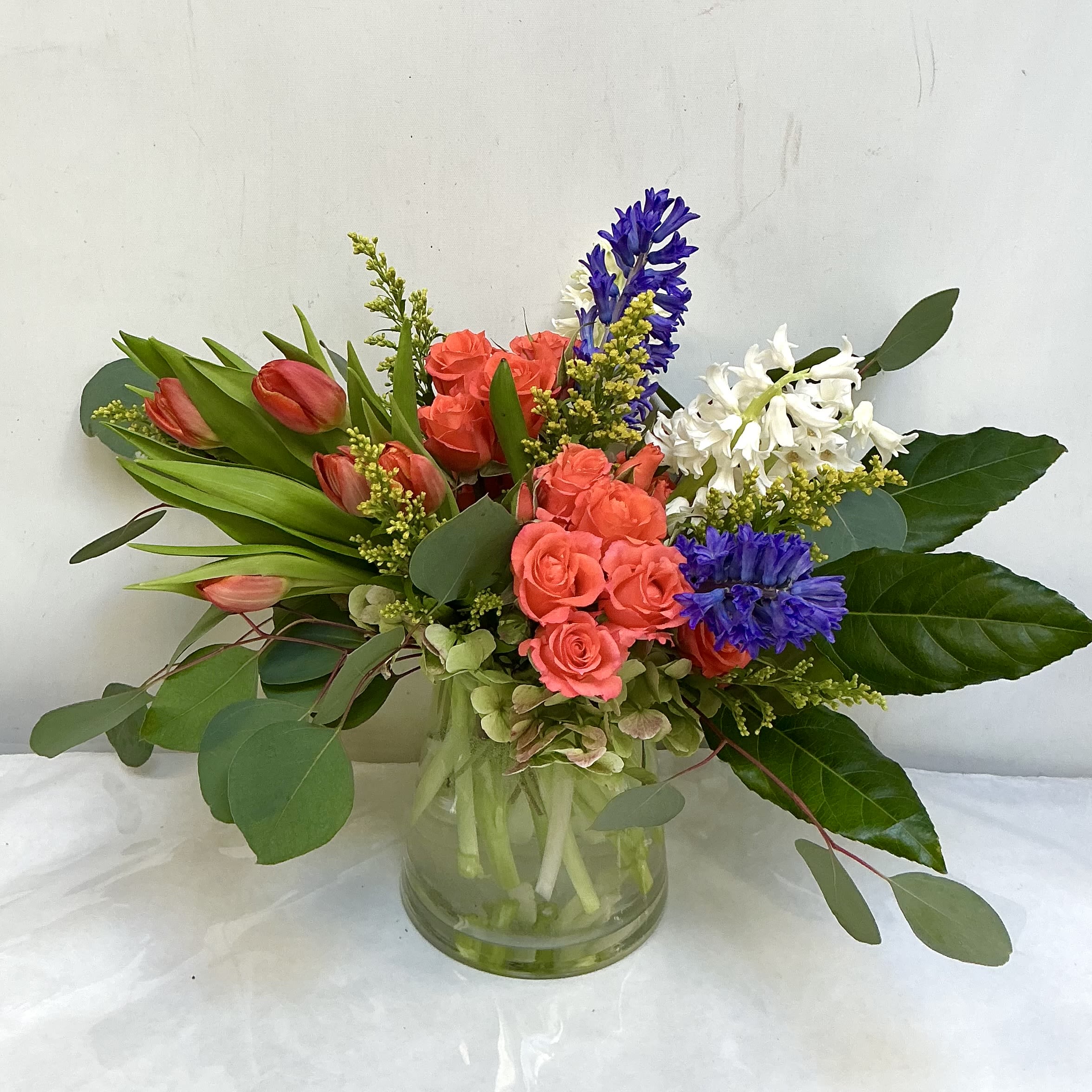 The Hudson Charm - A colorful, garden-inspired medley featuring bright tulips, fragrant accents, and airy greenery. The Hudson Charm brings a touch of natural elegance to any room.