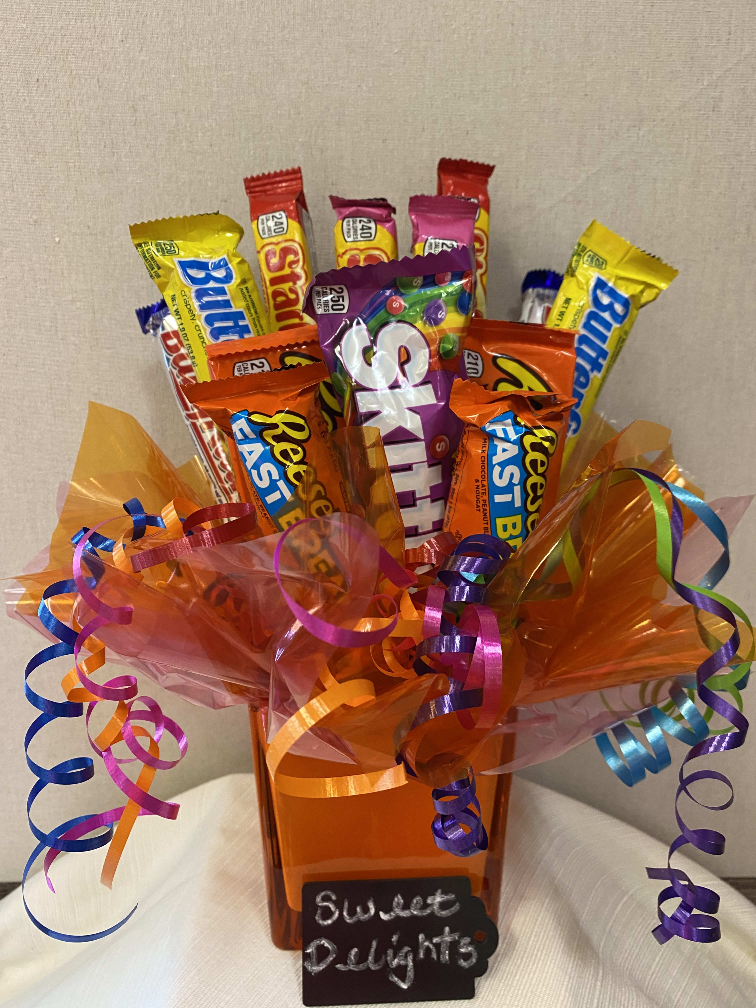 Sweet Delights - This arrangement of fruity flavors and Chocolates will delight anybody's taste buds. Total of 13 candy bars