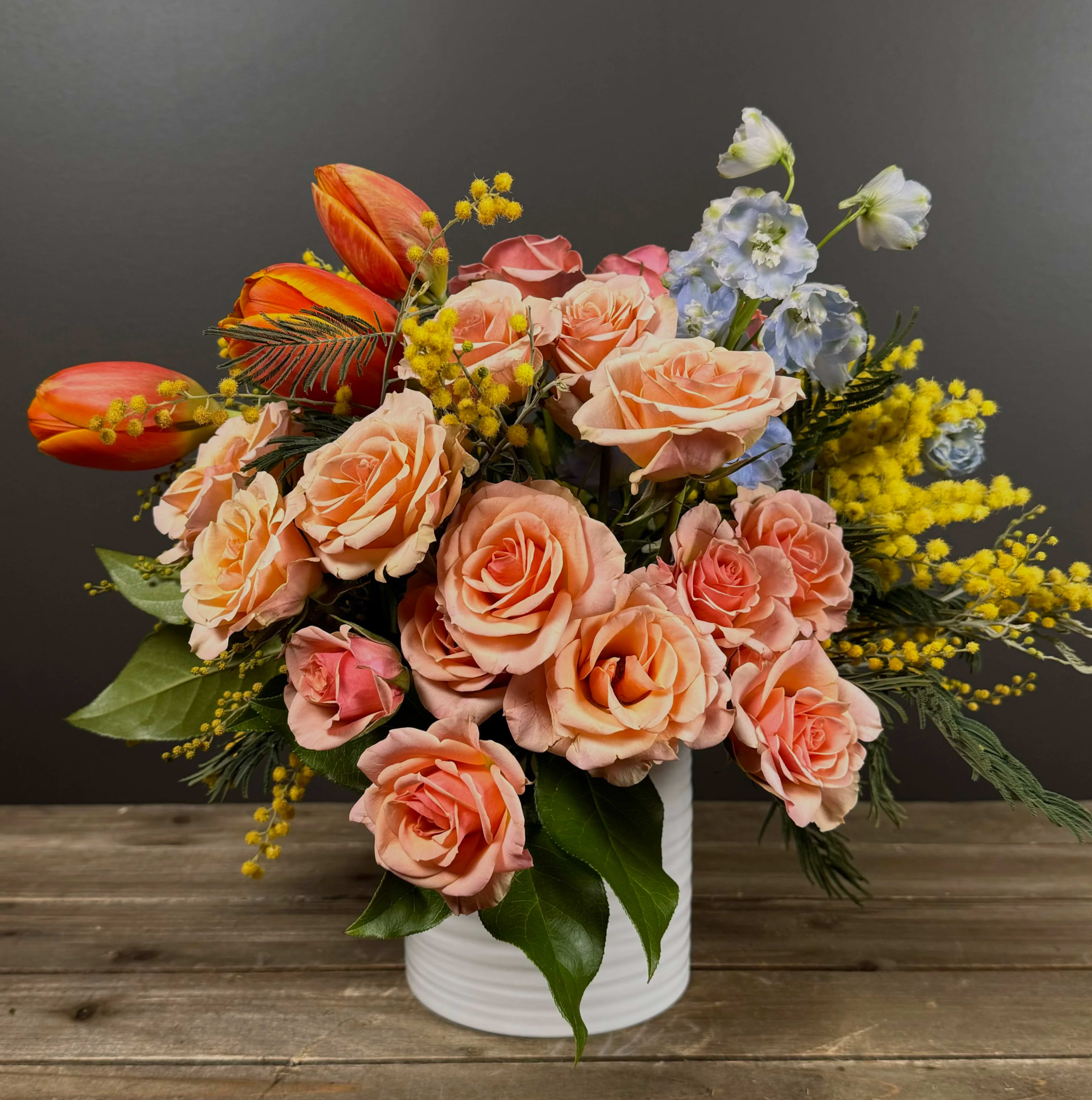 Spring in Bloom (Available February-May) - This beautiful bouquet says it all. Spring is here and with it the cheer of color and scent. Perfect for International Women’s Day or simply to celebrate the beginning of spring. 