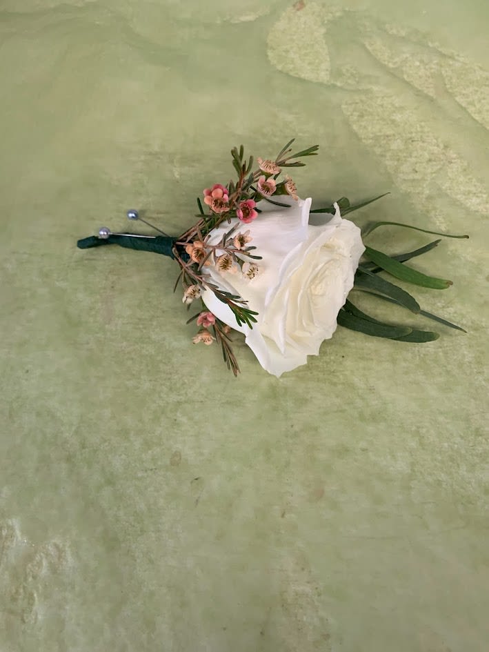 white rose boutennier -  single white rose with greenery and filler and two pins