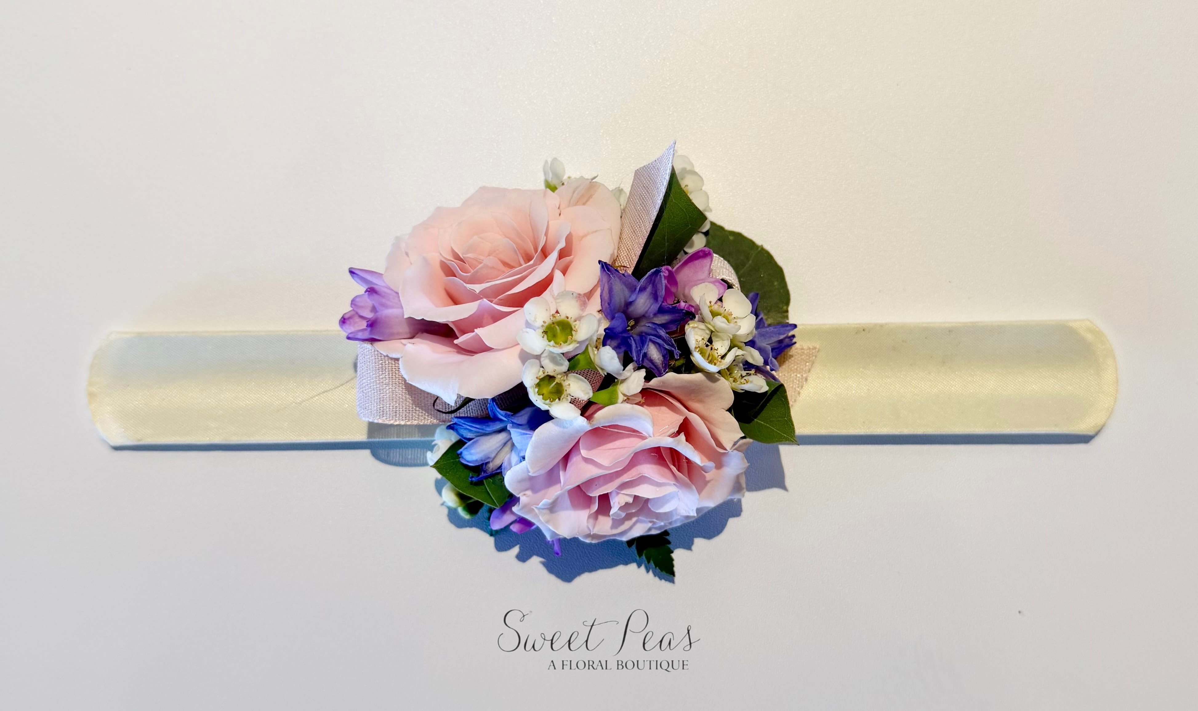 Daddy/Daughter Dance Wristlet (6-12yo) - Designed with little ones in mind, Sweetheart Slap Bracelet Corsage is comfortable and perfectly sized for ages 6–12, it’s a fun and stylish accessory for daddy-daughter dances and special occasions. A charming keepsake that adds a touch of floral magic to a night they’ll always remember.  Please include any color preferences in Special Instructions when ordering.  You are also welcome to text a picture of the dress to 651.730.9115 after placing your order.  Please include your order # and name when texting for reference.  