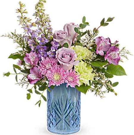 Teleflora's Garden Whimsy Bouquet - Surprise Mom with Teleflora's Garden Whimsy Bouquet, a soft blend of lavender and pink blooms beautifully arranged in Teleflora's Blue Belle Vase. This elegant Mother's Day gift adds fresh spring charm and lasting beauty to any space.