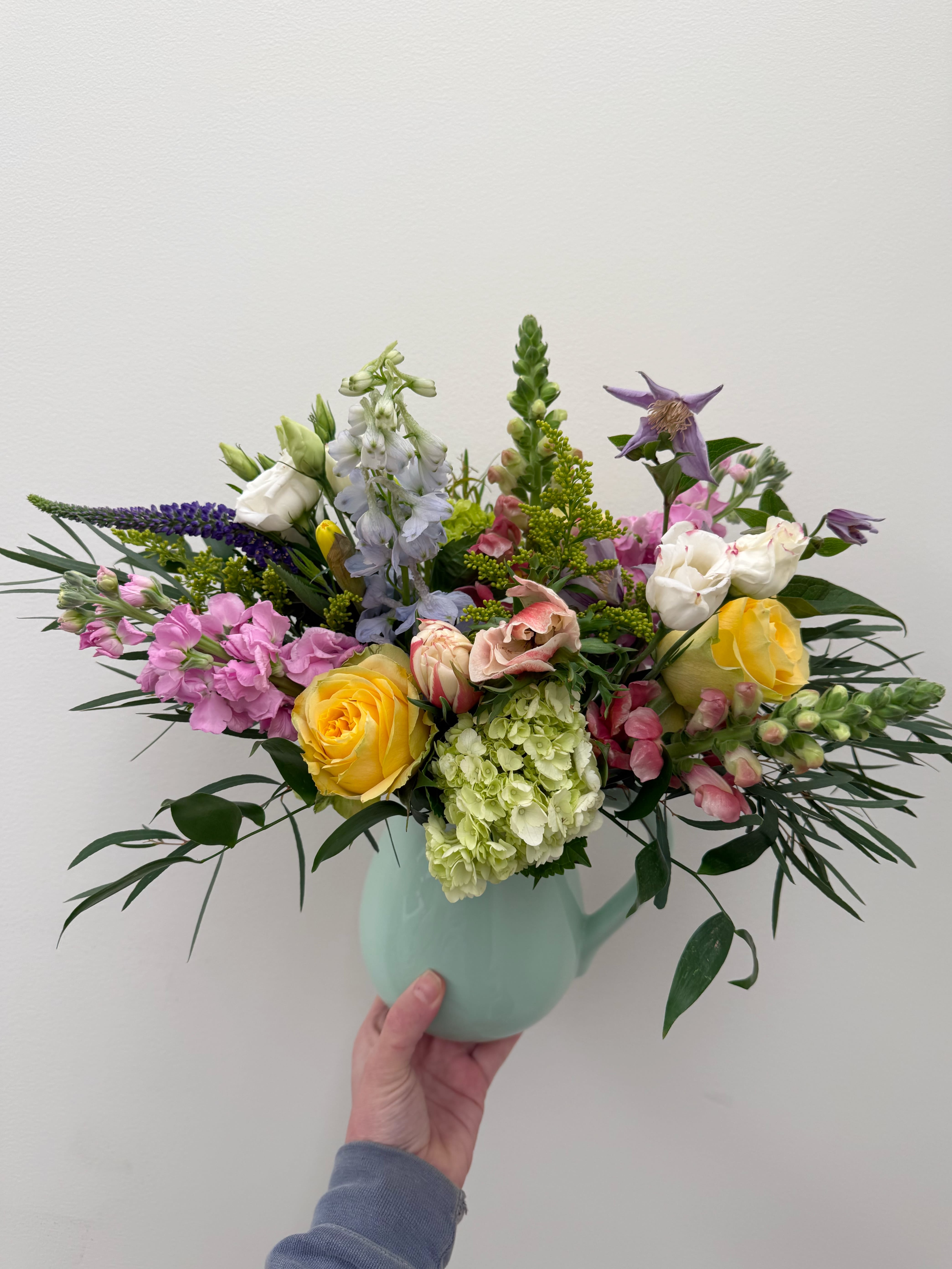 Spring pitcher  - A colorful mix of spring florals nestled into a classic pitcher.