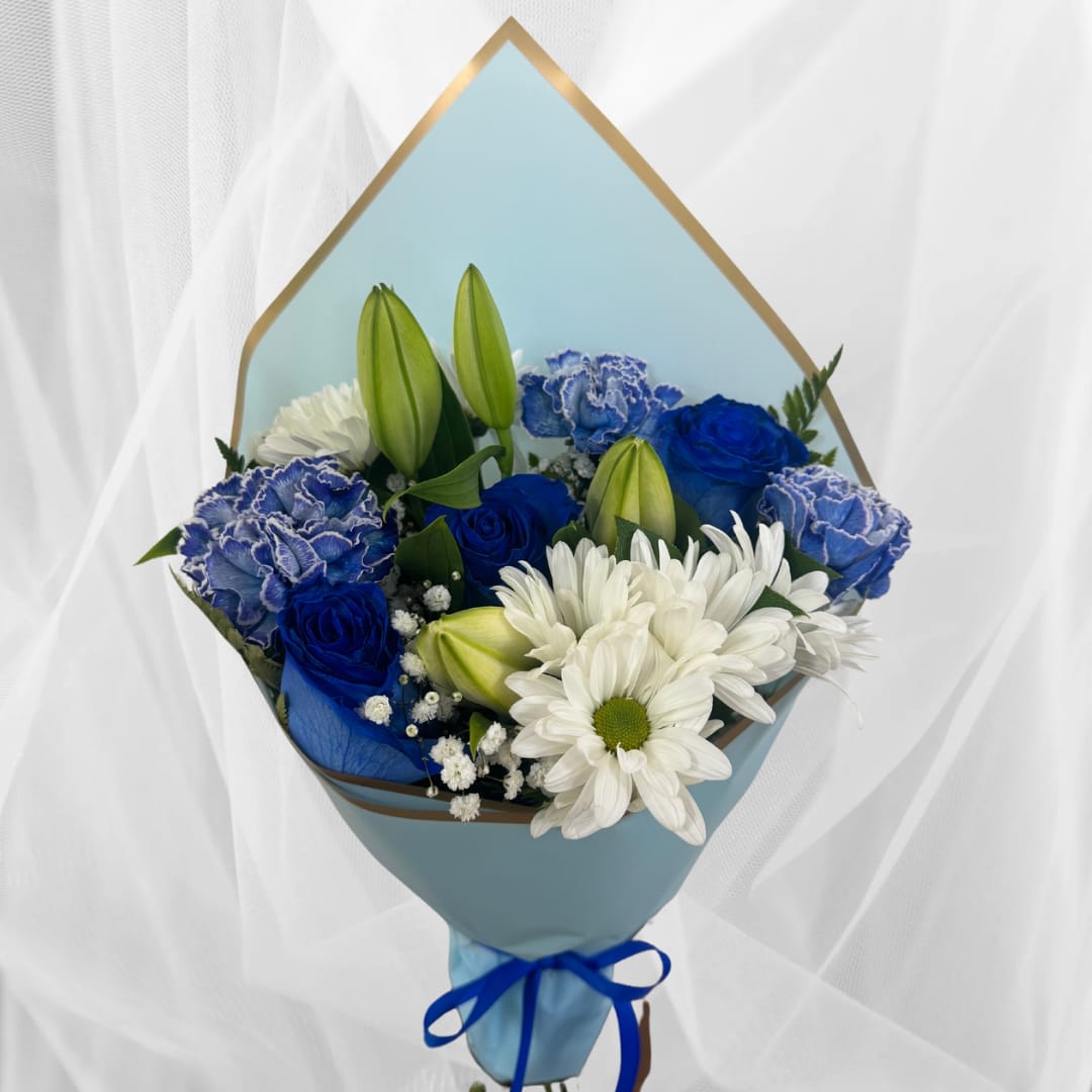 Hand-tied bouquet of blue roses, blue carnations, white daisies, and lily buds wrapped in blue paper