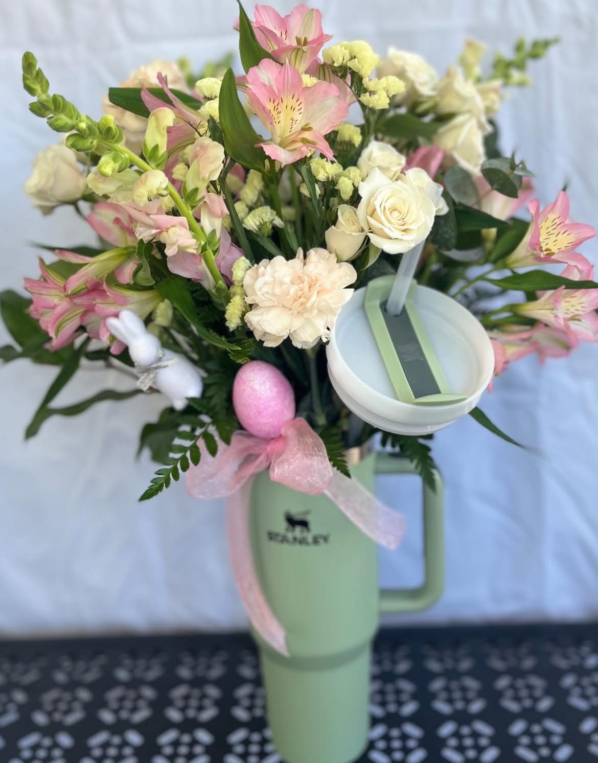 Spring Stanley - Better than an Easter Basket! 40 oz Stanley filled with the all the seasons freshest and prettiest blooms!   Please specify top 3 color choices or (lavender, blush, soft green, light blue,  ivory, hot pink most commonly available) and put in notes if you would like Easter decor included (bunny, egg, etc)