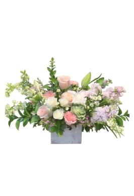 Blush Garden Elegance Bouquet - A lush, romantic arrangement designed in a rustic wood box, featuring soft blush and ivory roses, delicate hydrangea, lilies, and seasonal garden blooms. Accented with fresh greenery and a touch of succulent, this elegant piece brings timeless beauty and a fresh-from-the-garden feel to any space. 
