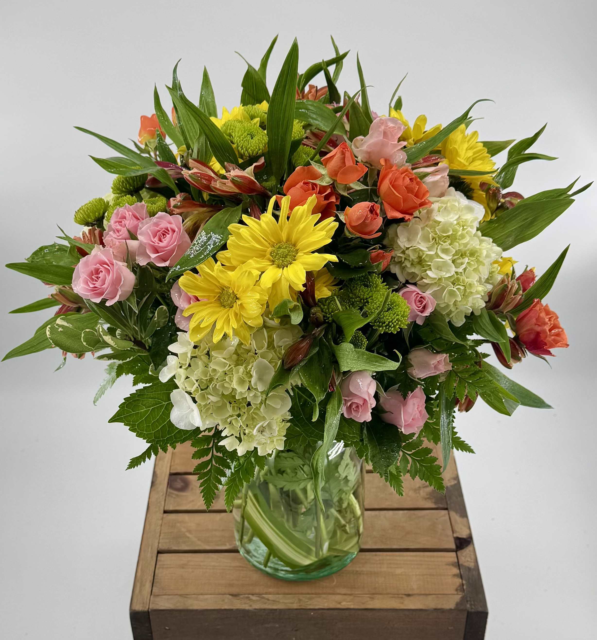 Life's a Peach (DL) - Introducing the "Life's a Peach"  Flower Arrangement, a charming and delightful bouquet featuring mini green hydrangeas, orange spray roses, orange alstroemeria, yellow poms, yellow poms. Green buttons, etc 