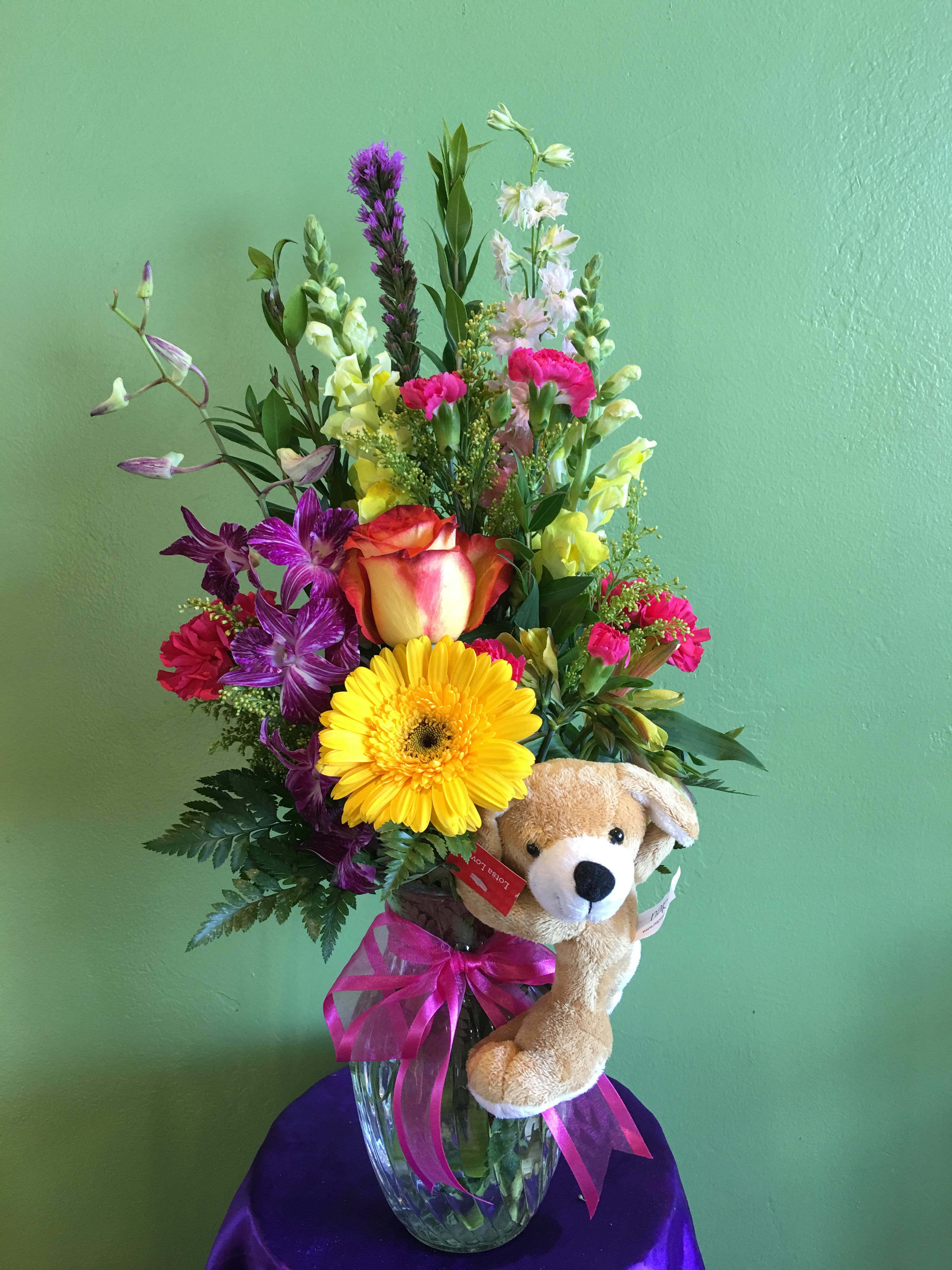 Doggie Hugs bouquet - Mixed spring flowers in a vase, holding by a little cutie dog.