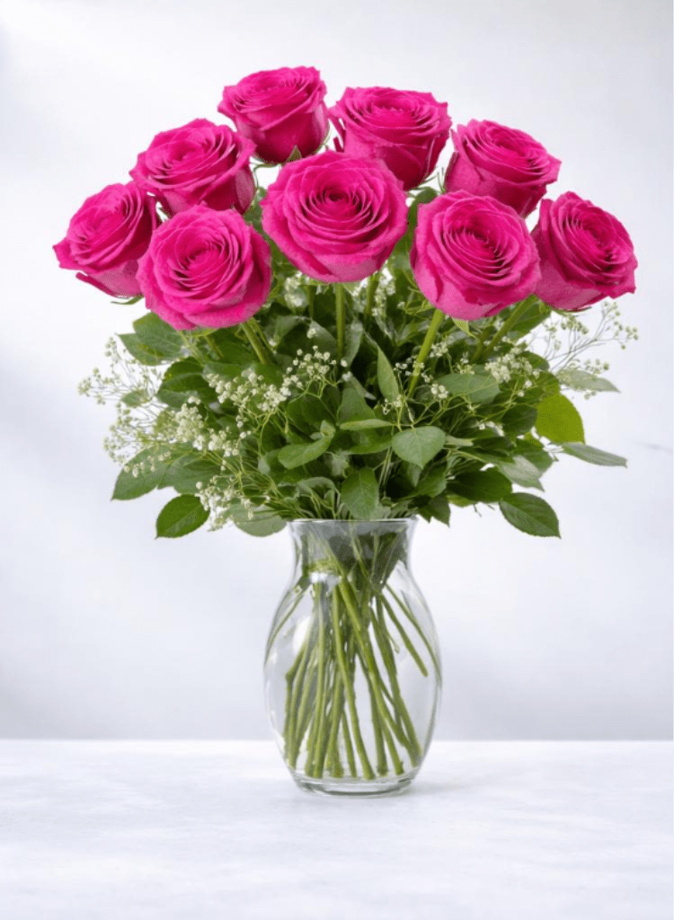 Hot Pink Rose Bouquet - Nothing speaks of love so much as a bouquet of beautiful roses. Arranged in a classic glass vase, this bouquet is a gift to her heart from yours. Standard rose bouquet includes 12 stems, approximately 18"H x 12"W, Deluxe rose bouquet includes 18 stems, approximately 19"H x 16"W, premium rose bouquet includes 24 stems, approximately 20"H x 18"W. 