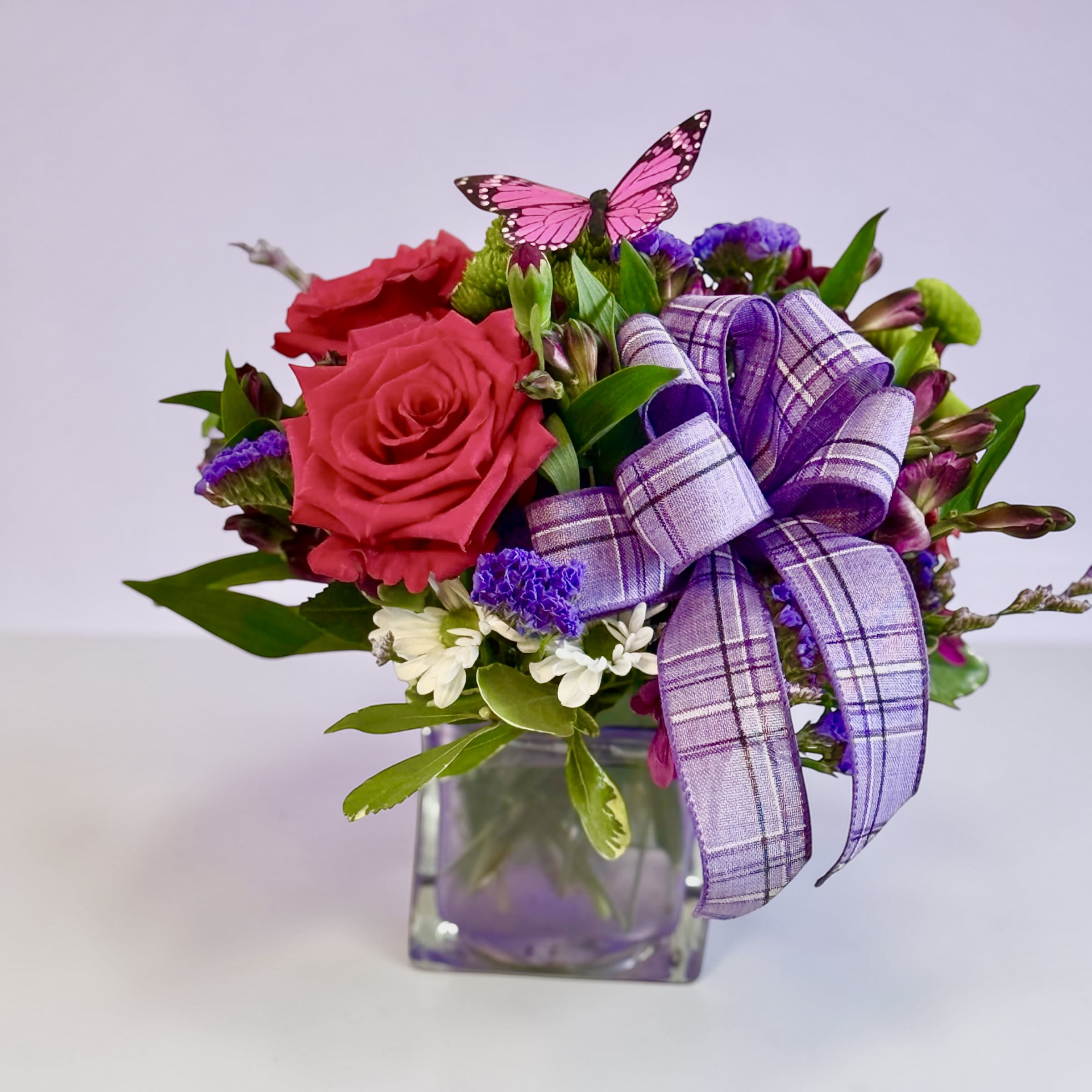 Petal Perfection’s Springtime Meadow  - Bring a little spring into any occasion with this cute cube arrangement.