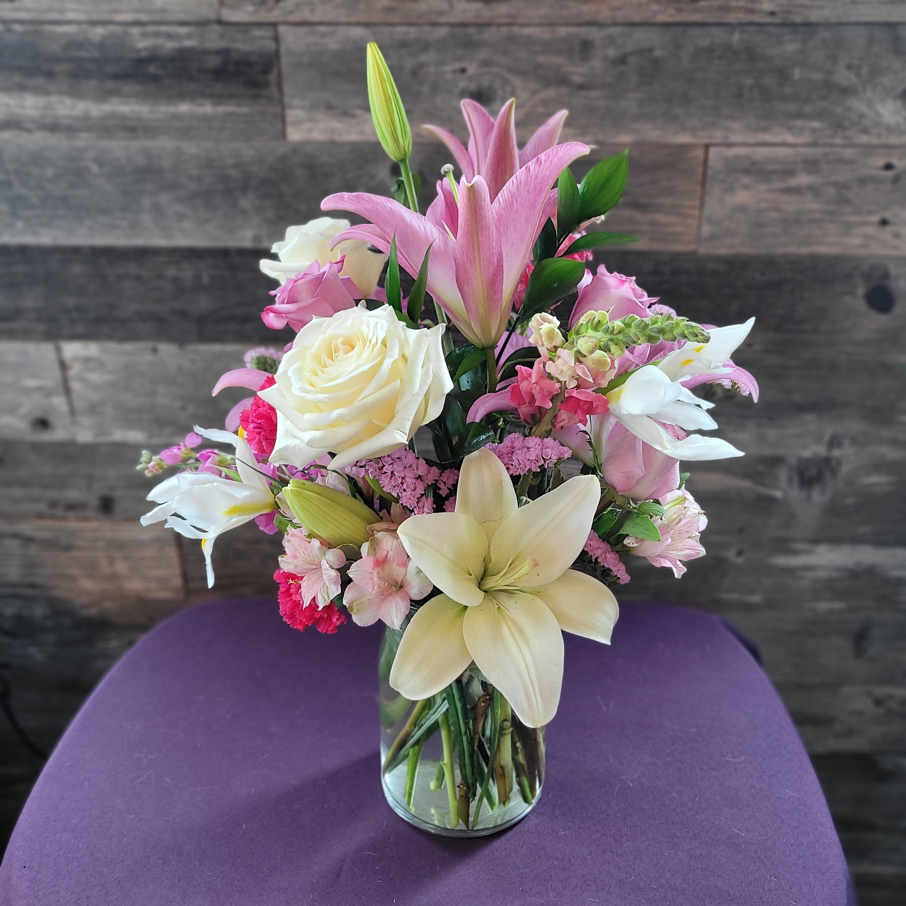 Secret Garden - Soft pinks, creamy whites, and elegant lilies in a clear vase—classic, romantic, and refined.