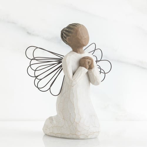 Kneeling angel figurine with wire wings and hands clasped at the chest