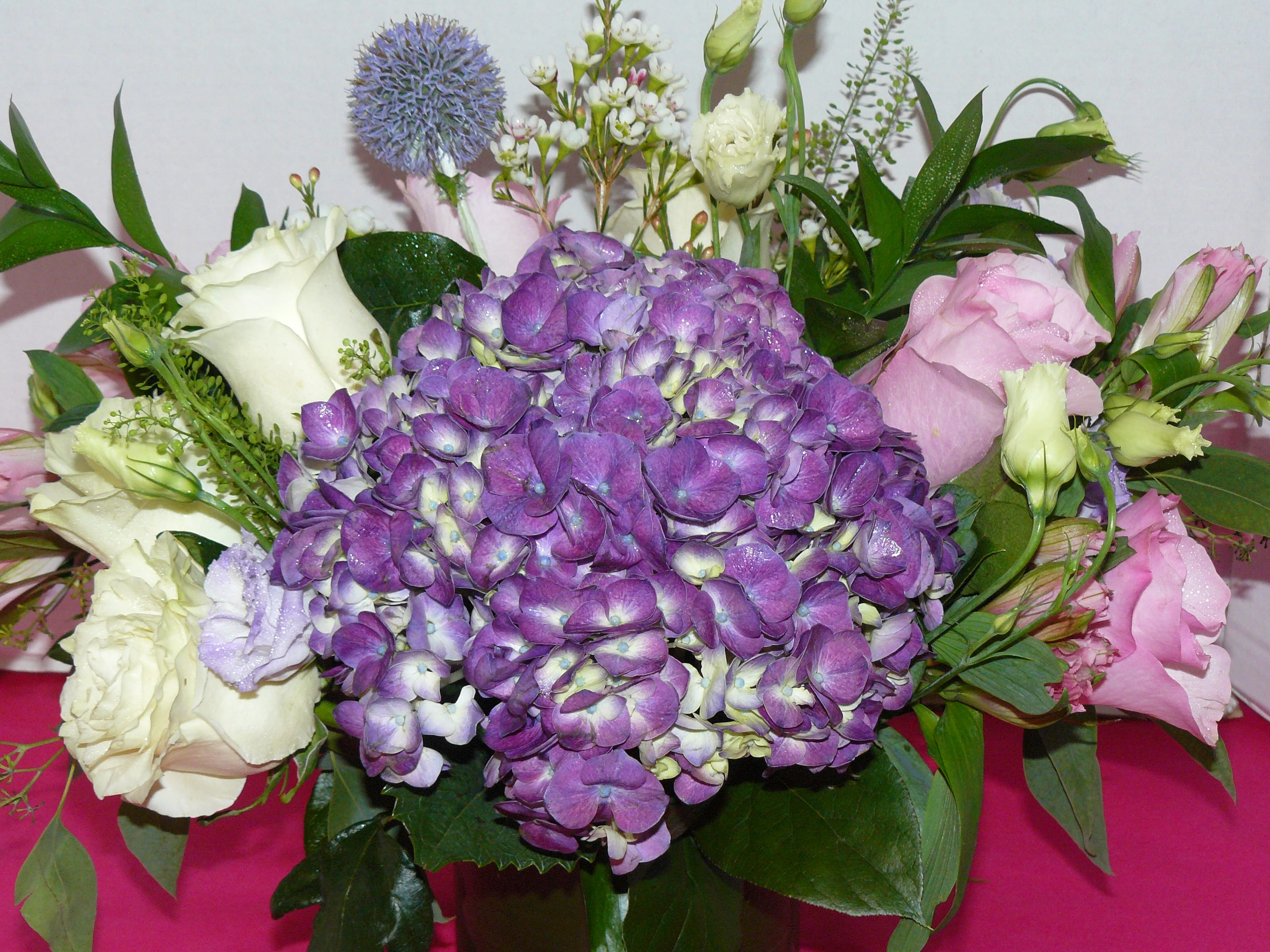 Dual Arrangement  ( May Not Be Available for Same Day)  - Purple Hydrangea, Purple Hydrangea, White Garden Roses, Pink Garden Roses, Lisianthus, Spray Roses, Alstroemeria, Penny Grass , Thistle, Fancy Greens  Substitutions May occur. 