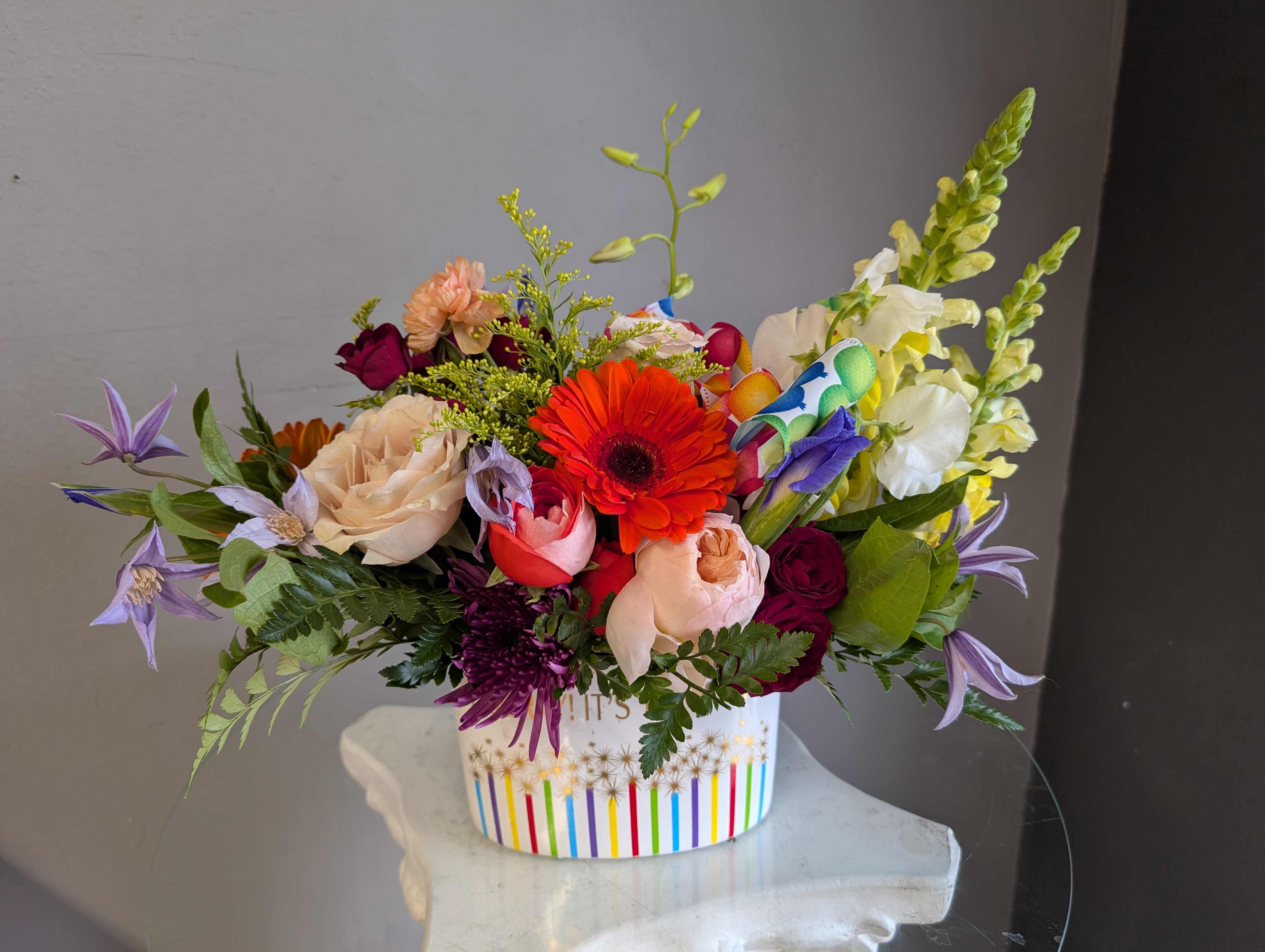 #744 Designer's Choice  - This beautiful flower arrangement of fresh mixed seasonal blooms is made by local designers in the heart Orange California. Hand crafted and perfect for a birthday. Can be sent as a local delivery or in-store pickup. This is an original, one of a kind arrangement. Order now before it's too late! 