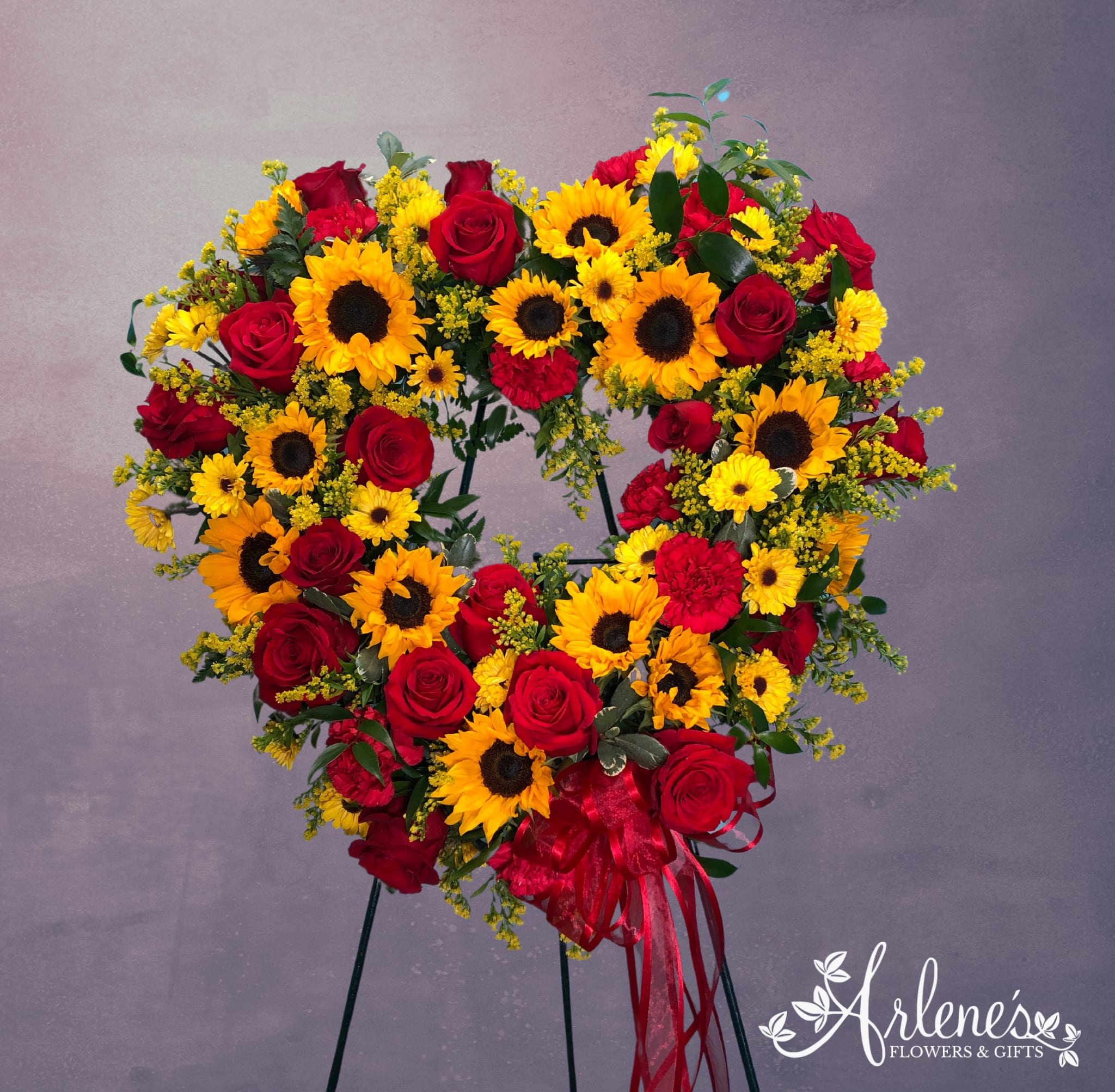 Sunflower Heart Wreath - Sympathy easel with sunflowers and mix of carnations, daisies and roses. Please call or make notes about any changes desired! 