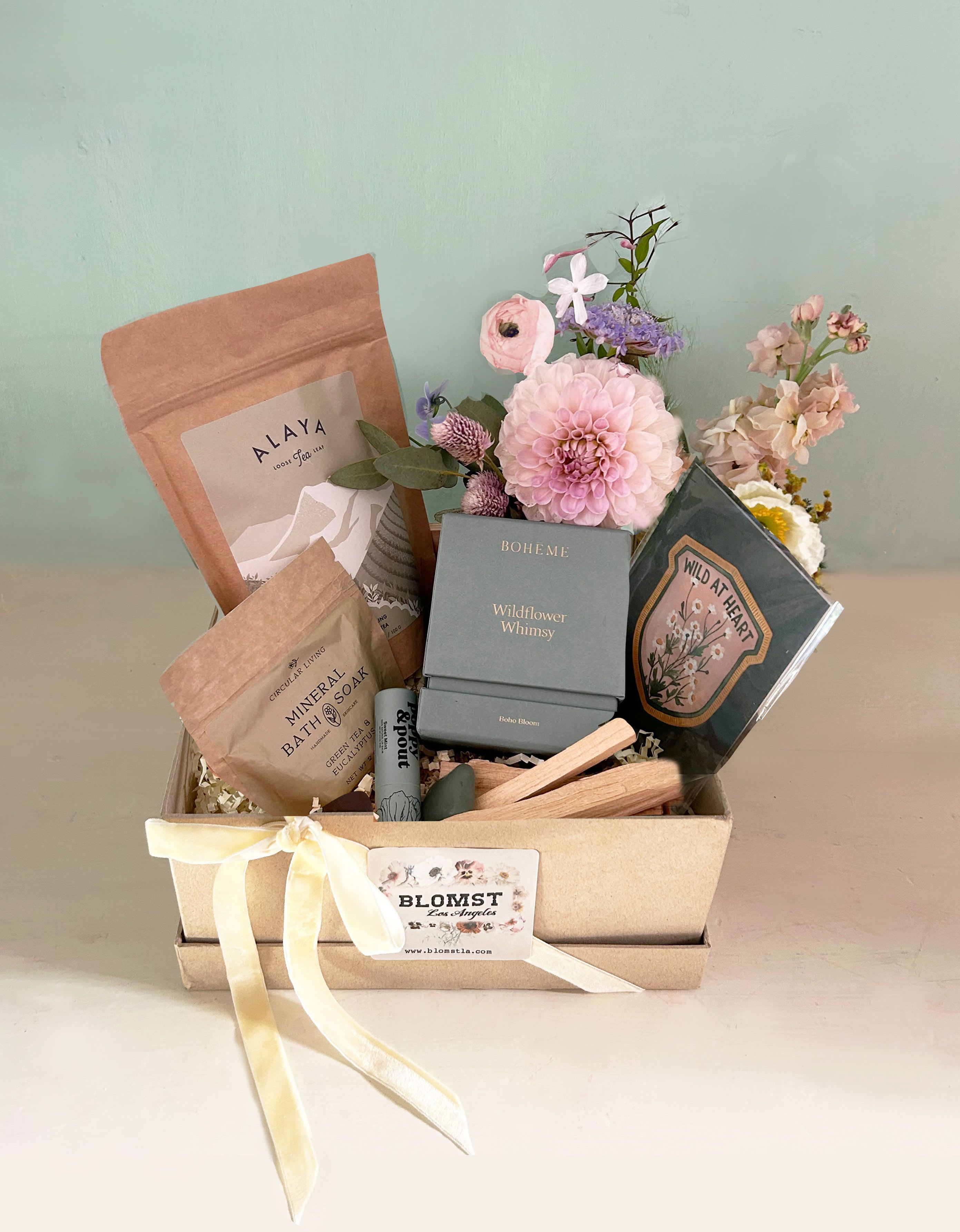 Wildflower Wellness Box - Native California plants and flowers, the colors of LA nature inspired this box of natural, floral treats. Treat a loved and dear one to beauty and flowers for some self care and love.  Wildflower Whimsey Natural Soy wax candle Eucalyptus/Green Tea natural bath salt Alaya Green Tea Poppy and Pout natural mint lip balm Palo Santo sticks Wild at Heart card w envelope Blomst mini arrangement Green crystal 