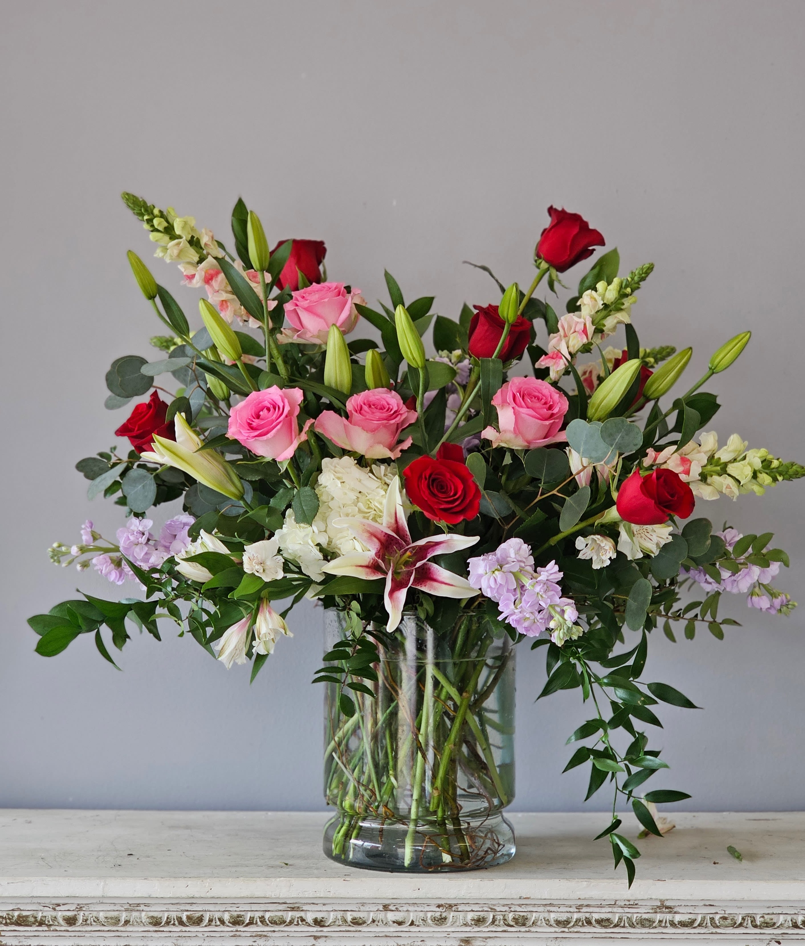 Love is in the air - Colorful, bold vase of roses and lilies