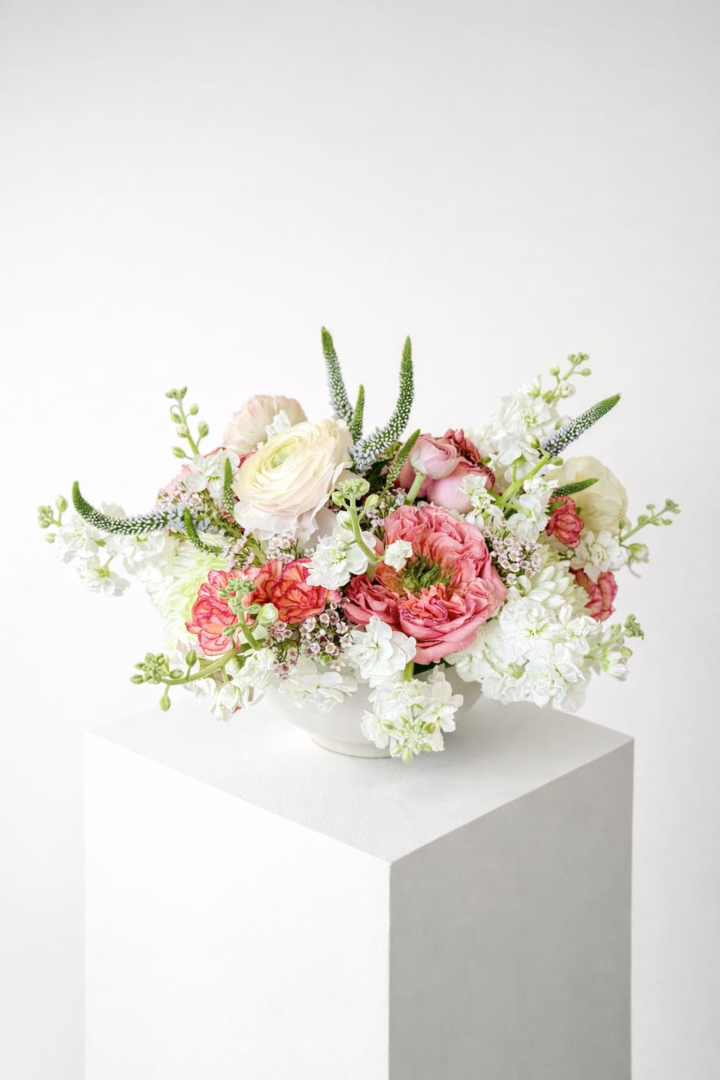 Medium Bloom Bowl  - A refined, garden-inspired arrangement designed to bring softness and elegance into any space. The Medium Bloom Bowl features a curated blend of premium seasonal blooms in blush, cream, and fresh white tones, layered with delicate textures and natural movement.  Designed low and full in a modern ceramic bowl, this piece highlights signature Blooms By Devin styling—organic shape, airy composition, and thoughtful balance between structure and softness. It’s perfect for coffee tables, dining settings, gifting, or adding a touch of everyday luxury to your home.  Each arrangement is created using the freshest flowers available, with slight variations that maintain the overall color palette and design style. 