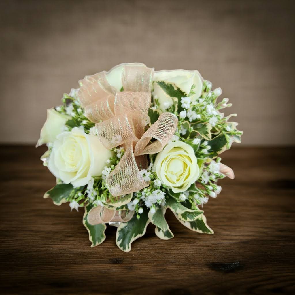 Small bouquet of white roses with a sheer ribbon