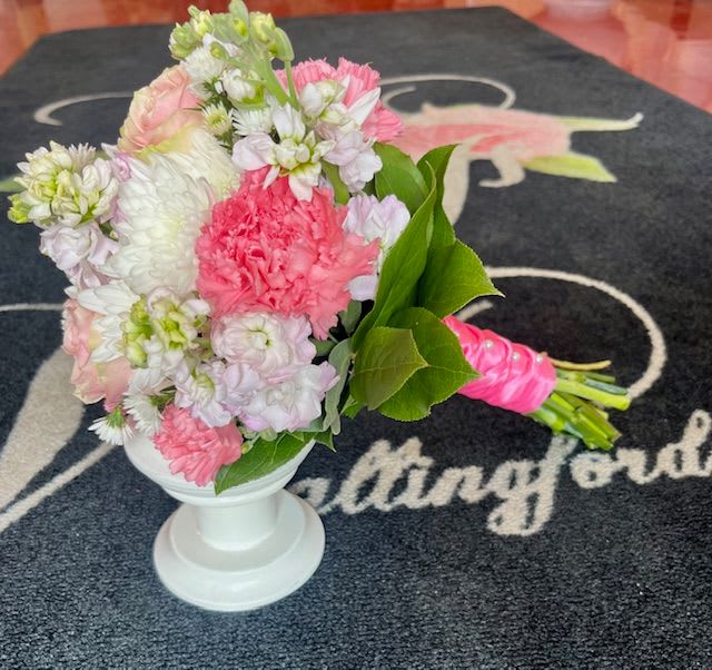 Taylor - This sweet handheld bouquet is perfect for Prom! A mix of pink, white, and lavender flowers will be the perfect finishing touch for your day! 