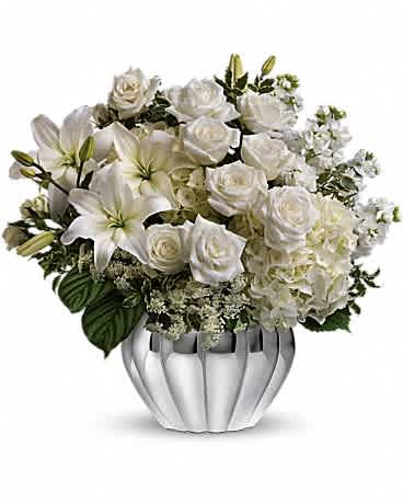 Teleflora's Gift of Grace Bouquet - Elegantly understated, this stunning array of white roses and lilies in a stylish silver scalloped design bowl is an eloquent way to convey your love and support. The elegant bouquet includes white roses, white spray roses, white asiatic lilies, white stock and queen anne's lace, accented with assorted greenery. Delivered in a silver scalloped design bowl.