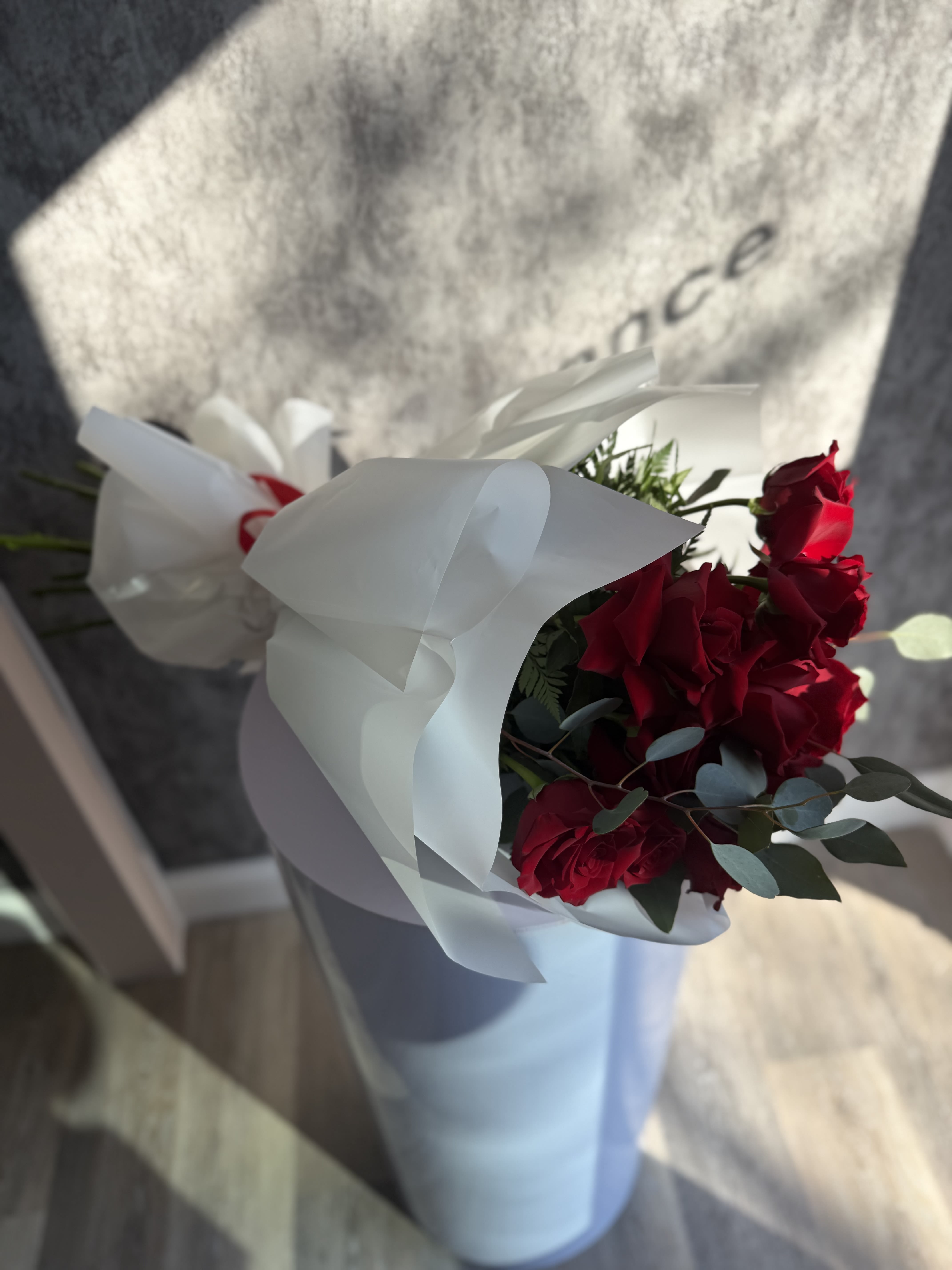 Classic Passion  -  A stunning bouquet of rich red roses wrapped in paper for a bold and romantic statement. This arrangement radiates passion, elegance, and warmth-perfect for anniversaries, special surprises.