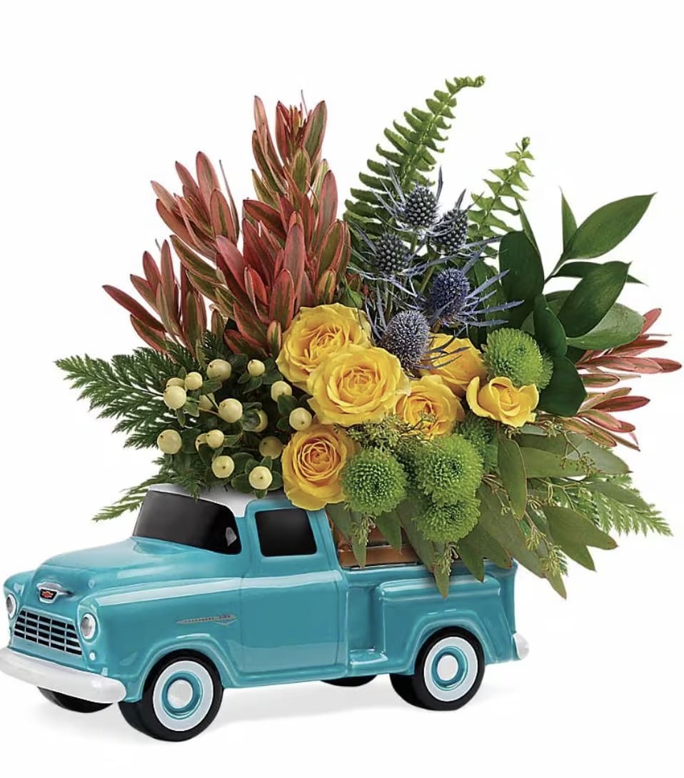 Timeless Chevy Pickup  - This bouquet includes yellow spray roses, green button spray chrysanthemums, yellow hypericum, blue eryngium, israeli ruscus, seeded eucalyptus, sword fern, and leatherleaf fern. Delivered in a Chevy Pickup Keepsake.  