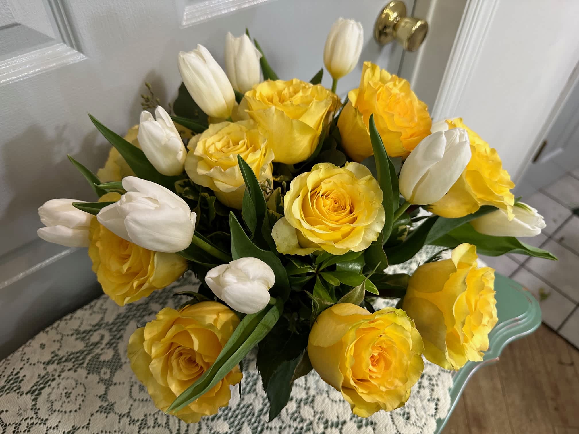 Yellow &amp; White Arrangement - 1 Dz  standard yellow roses,  Tulips(Seasonal) , Assorted Fancy greens White Flowers will substitute  when white Tulips not available