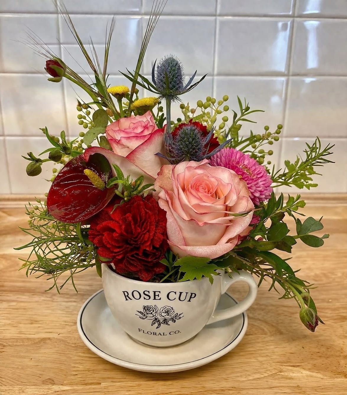 Rose Cup -  A fresh floral coffee or tea cup arrangement is a charming gift perfect for Mother’s Day, birthdays, thank-yous, or just because. Designed in a keepsake cup with fresh seasonal blooms, each arrangement brings together beauty and function for a thoughtful gift that feels both elegant and personal. Ideal for flower lovers, tea lovers, and anyone who appreciates a creative floral touch.