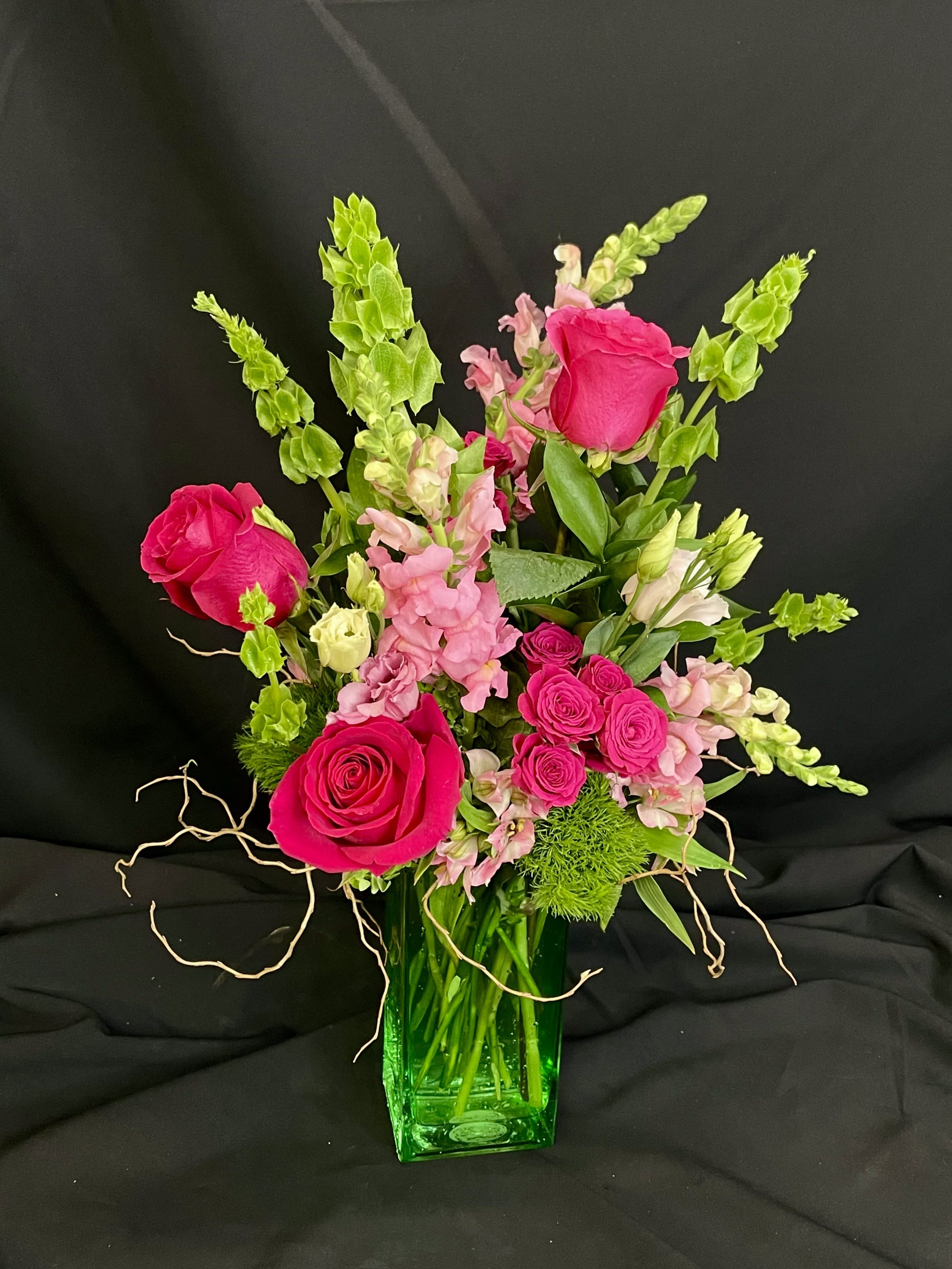 In The Rose Garden - A beautiful hot pink and green arrangement to embrace any season with, but especially to remind you of special times in the garden!