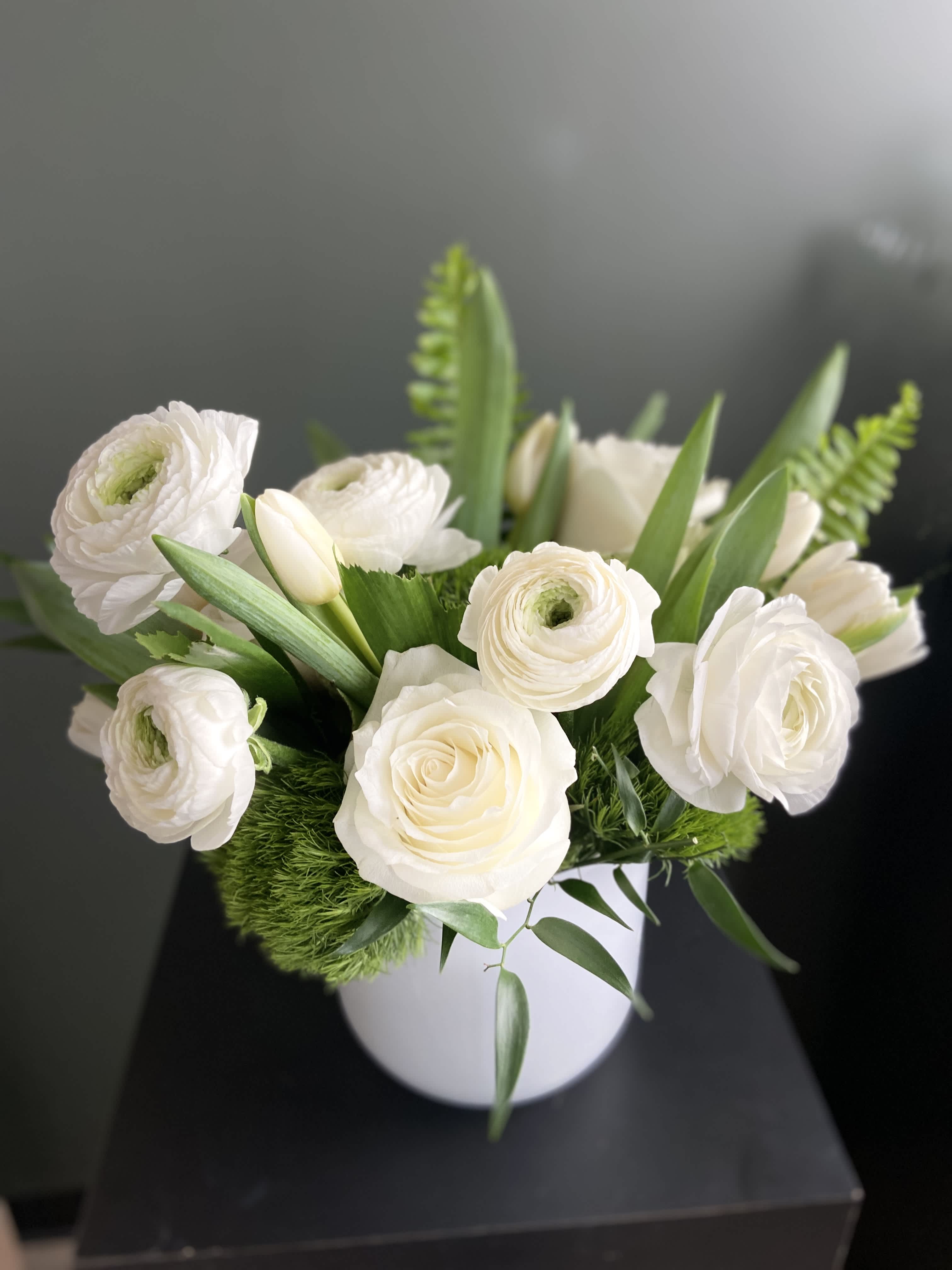 Crisp Linens - This petite all white arrangement is as fresh as crisp white linens. This arrangement is perfect to be placed by your bedside or coffee table. 