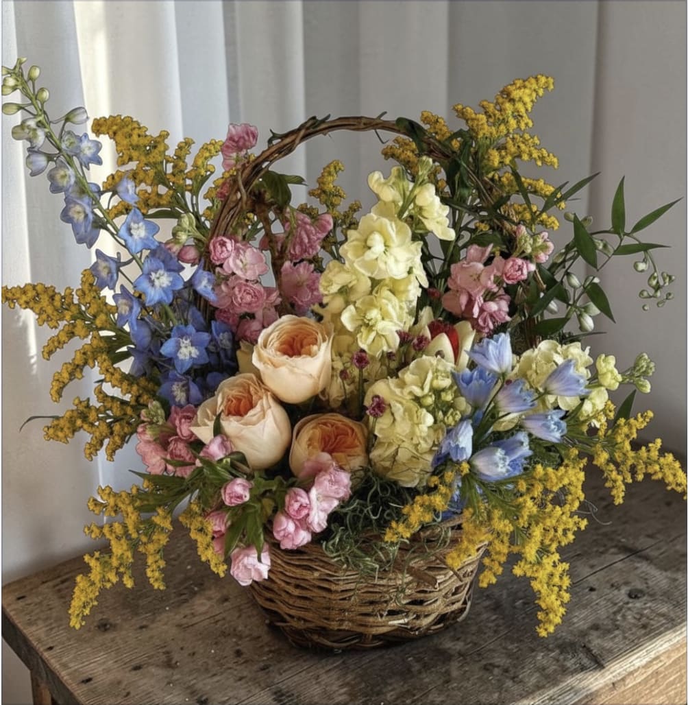 A Bushel and a Peck  - This basket absolutely full of bright, beautiful spring blooms is sure to brighten your heart and home this spring! 