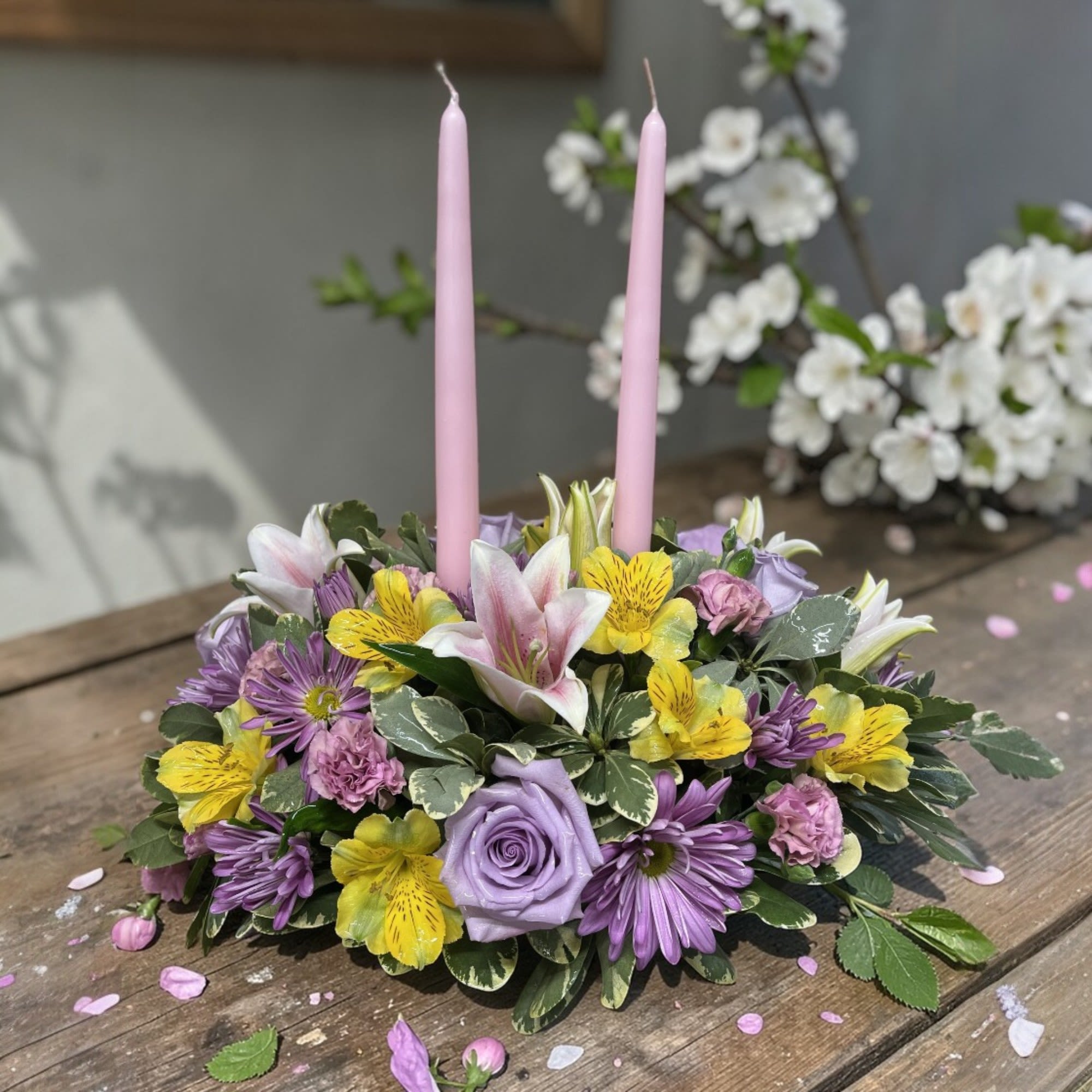 Easter Centerpiece - Your family dining table needs this beautiful and elegant centerpiece full of premium spring blooms with two coordinating pastel candles.