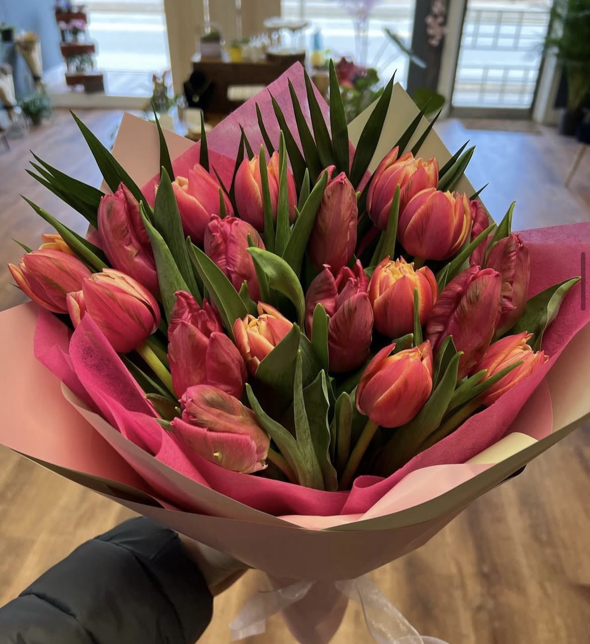 Specialty Tulip Wraps  - Local grown, specialty tulips in all colors and assortments. Standard is 15 stems  of specialty double tulips wrapped beautifully. Deluxe is 30 stems