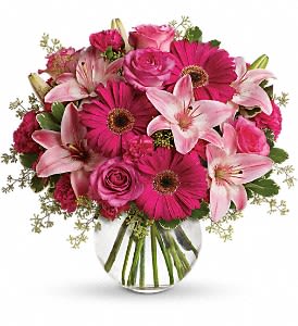 A Little Pink Me Up - Sometimes all you need is a little pink me up! An ideal pick for anyone whose favorite color is pink, this stylish mix is full of variety and comes presented in a clear glass bubble bowl they'll use again and again. A wide variety of flowers including pink roses, pink asiatic lilies, hot pink gerberas, pink carnations and hot pink miniature carnations are mixed with fresh variegated pittosporum and seeded eucalyptus. Presented in a gorgeous glass bubble bowl. Orientation: All-Around