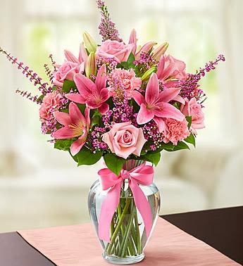 Expressions of Pink - Expressing your feelings should always be this easy. Let our beautiful arrangement send the right message, with its stunning fresh pink blooms, including roses, lilies, carnations and more, hand-arranged by our florists inside a classic vase. With sophistication and style, it will have them smiling no matter what the occasion.