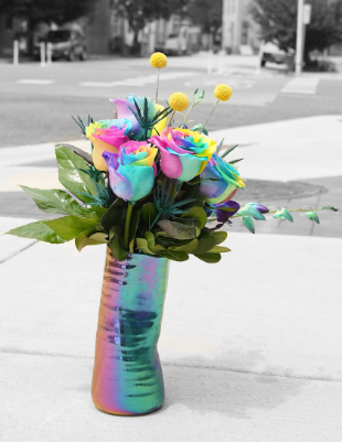 Central Ave - Mix of bright orange roses and blue hydrangea with tropical ti leaves