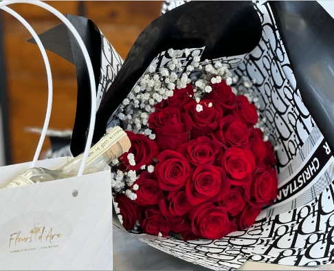 Dior Dior - What a perfect package.... 2 doz roses accompanied with a bottle of Casa Migos in a not so Dior bag.... Dior paper is available but you can have plain black if you prefer. Include rose and paper color in the notes.
