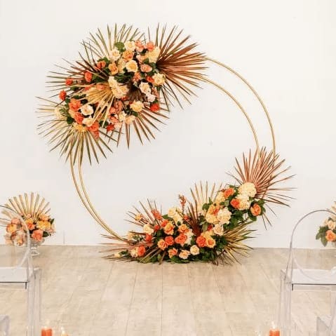 Double Hoop - Gold - Create your own backdrop or focal point at your event. This metal circle arch is a beautiful addition to your event covered in florals, greenery or balloons. Lightweight metal is easily weighted with sand bags (not included). 6ft Tall 6ft Wide Ordering online is not available. Call or email to inquire availability and additional fees.