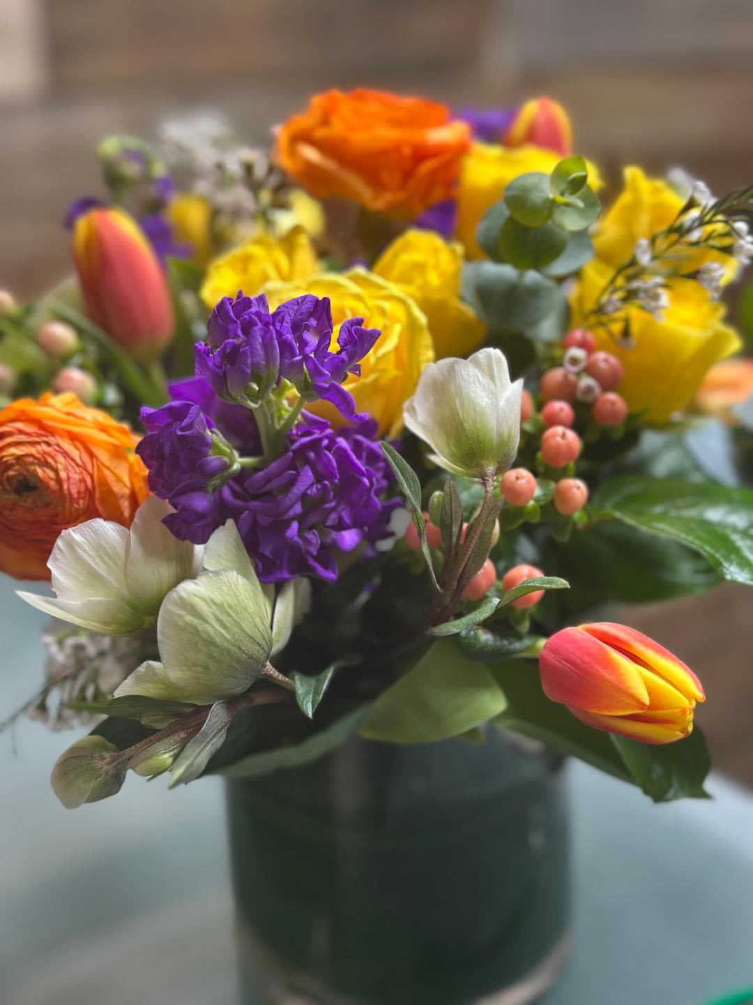 Petal Pop - A fun and vibrant burst of bright, cheerful blooms, Petal Pop is designed to make a statement. With its lively colors and playful style, this arrangement brings instant joy and energy to any space. Colors and flowers may vary due to availability.