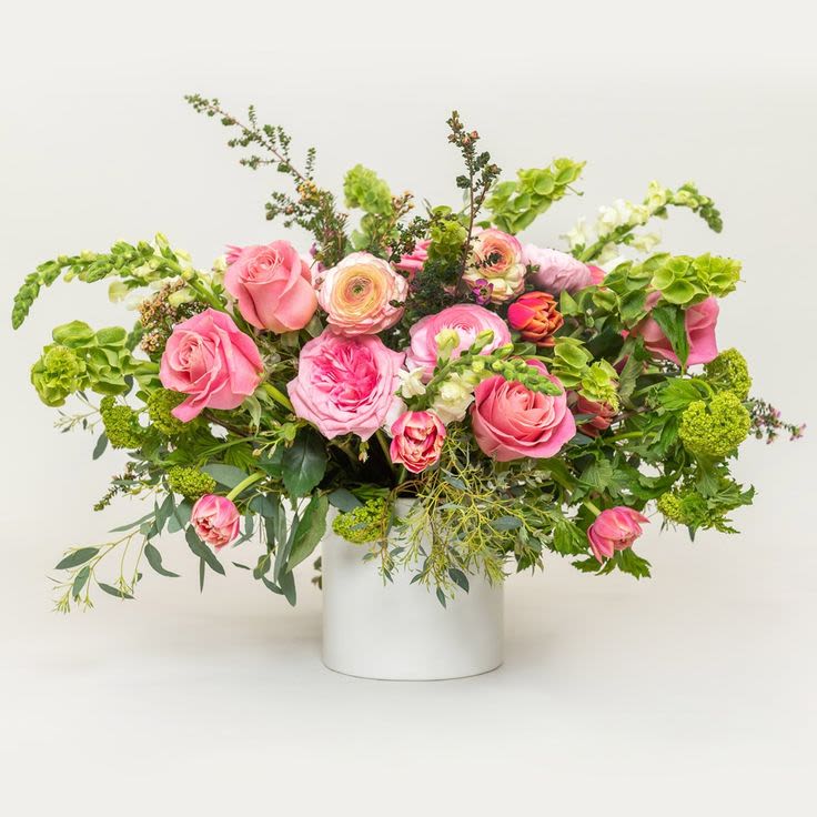 Brightly Beauty - Gorgeous arrangement of seasonal blooms and foliage — this lovely flower arrangement is perfect to gift to the queen in your life. Sure to impress, with freshly picked and vibrant flowers artfully arranged in a garden-style formation. It's the perfect way to commemorate a special occasion!