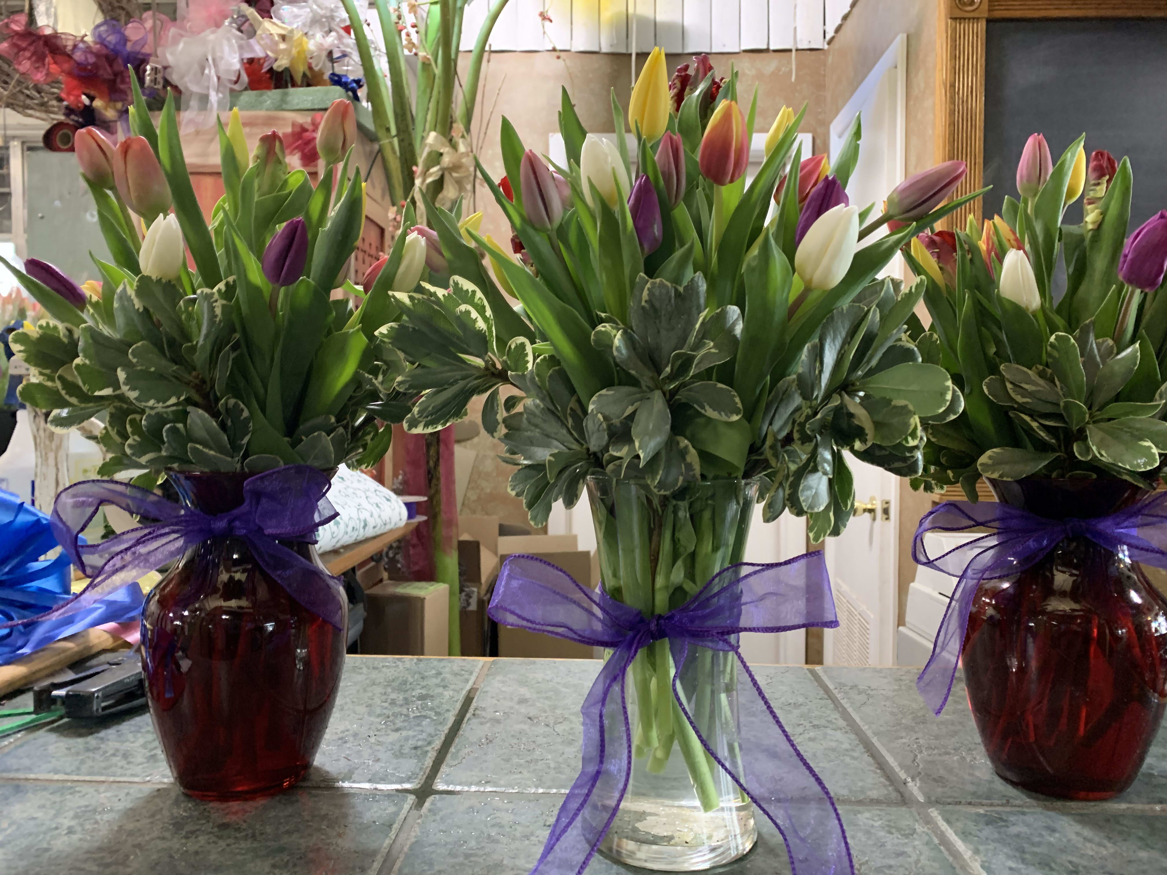 LOTS OF TULIPS SAY HAPPY EASTER!!! - Beautiful and "simply said" colorful tulips are a hip way to show you care.  2 Dozen Tulips arranged in assorted vases. 