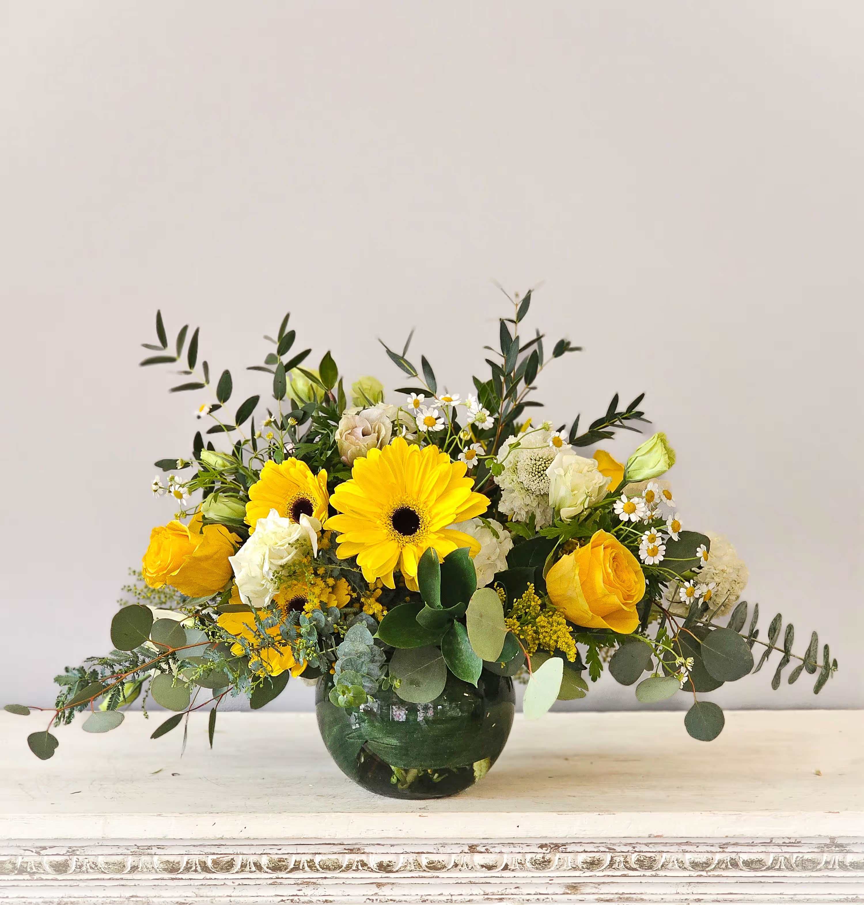 Golden Summer - A ray of sunshine describes this monochromatic vase of yellow and white blooms.