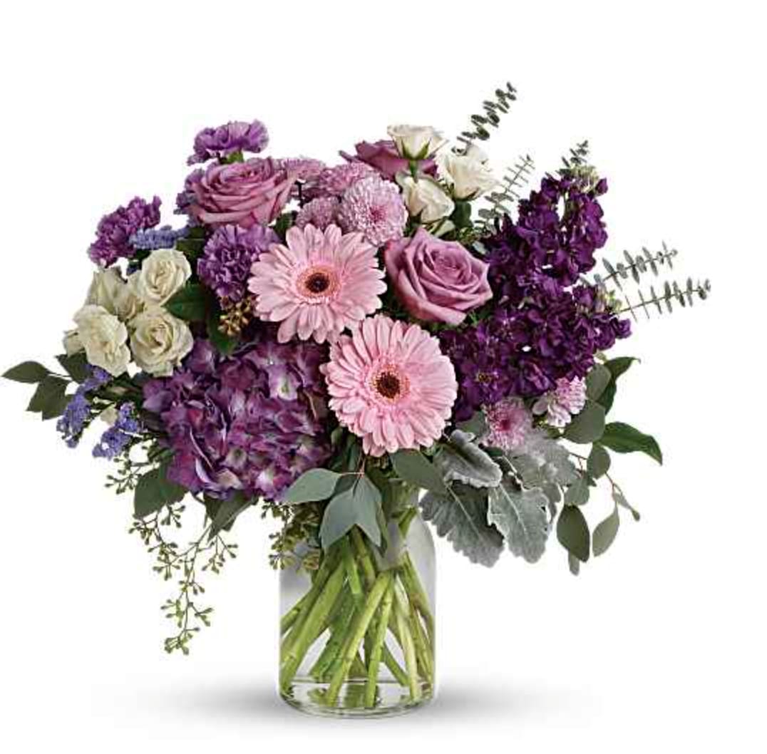 Grand Bouquet - Bring beauty to any occasion with the deep purples and playful pinks of this breathtaking bouquet. This magnificent bouquet features purple hydrangea, lavender roses, crème spray roses, pink gerberas, lavender carnations, purple stock, lavender cushion spray chrysanthemums, lavender statice, dusty miller, spiral eucalyptus, seeded eucalyptus, silver dollar eucalyptus, and lemon leaf. 