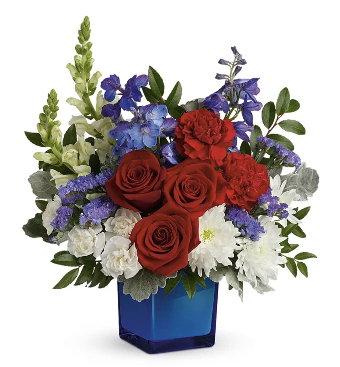 America's Colors - The colors of joy! This cool cobalt cube complements classic red, white and blue blooms. This arrangement includes red roses, red carnations, miniature white carnations, blue delphinium, white snapdragons, white cushion spray chrysanthemums, blue sinuata statice, huckleberry and dusty miller. Delivered in a Color Splash Cube.